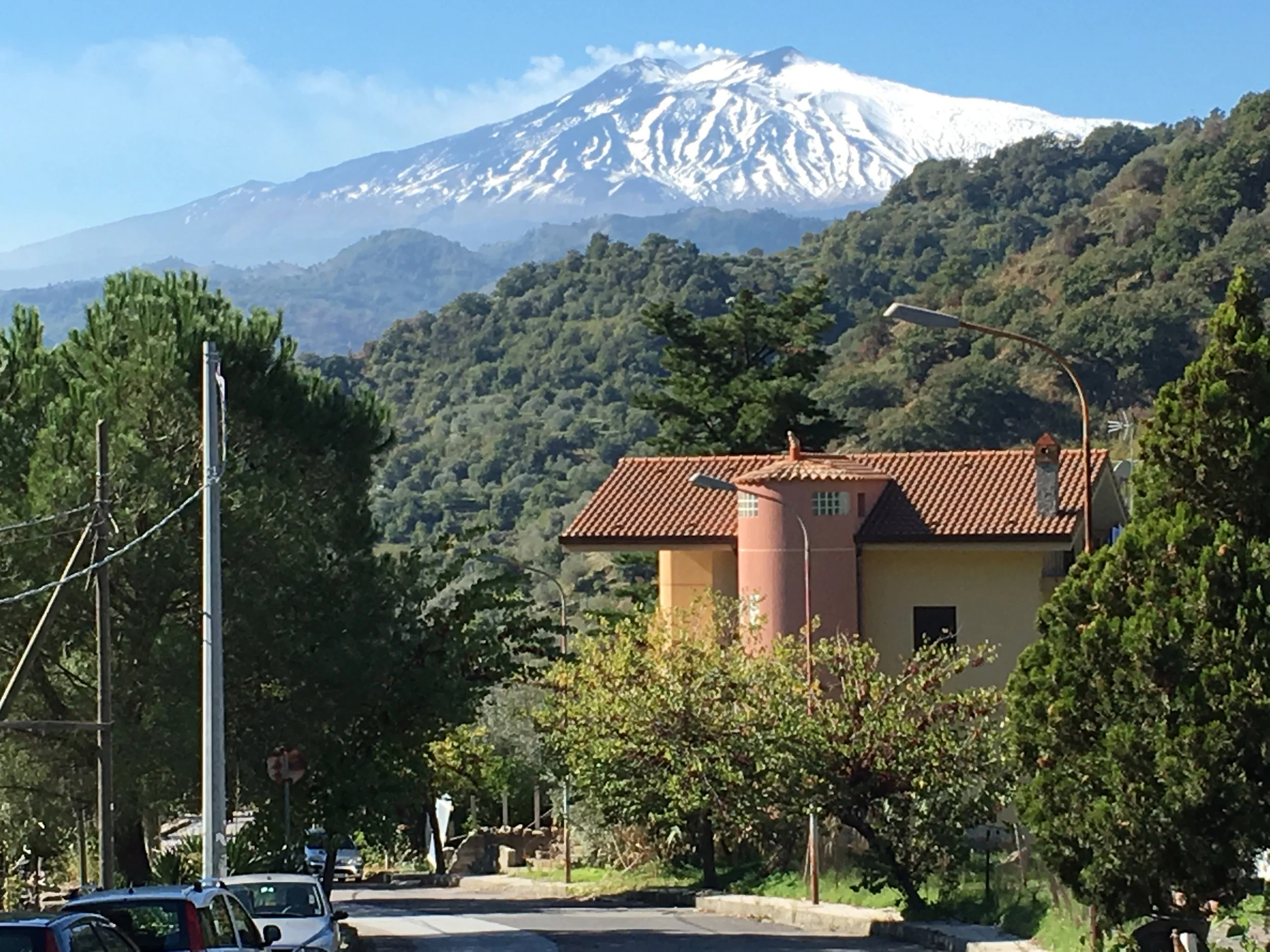 Constantly smoking Mount Etna looms over Graniti . Local rain topped it with snow while we were there.