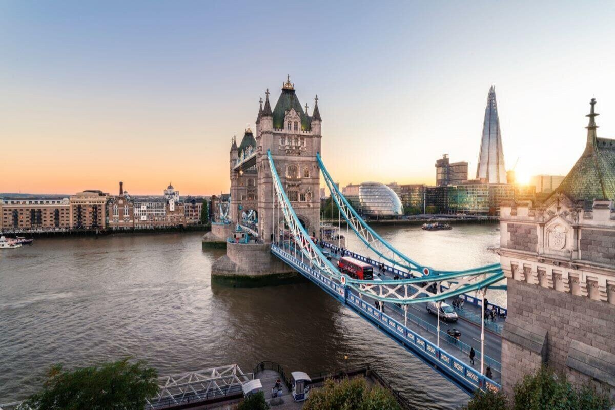 London landmarks include the Tower Bridge, pictured with the point Shard skyscraper to the right and the river flowing below.