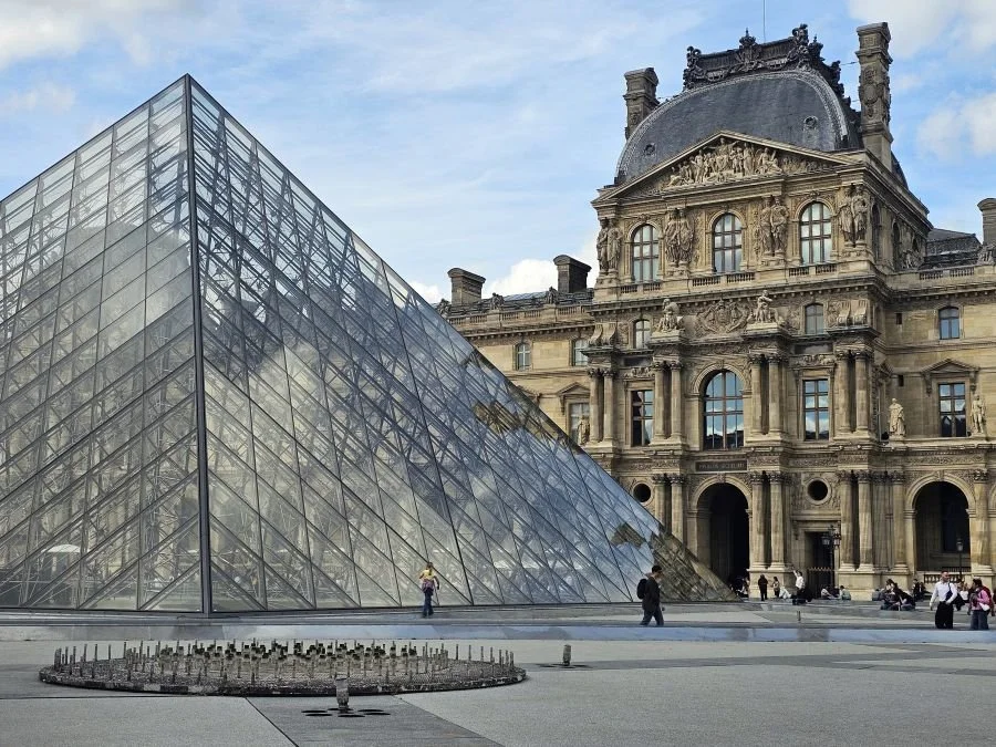 A glass pyramid in front of the Louvre museum in Paris