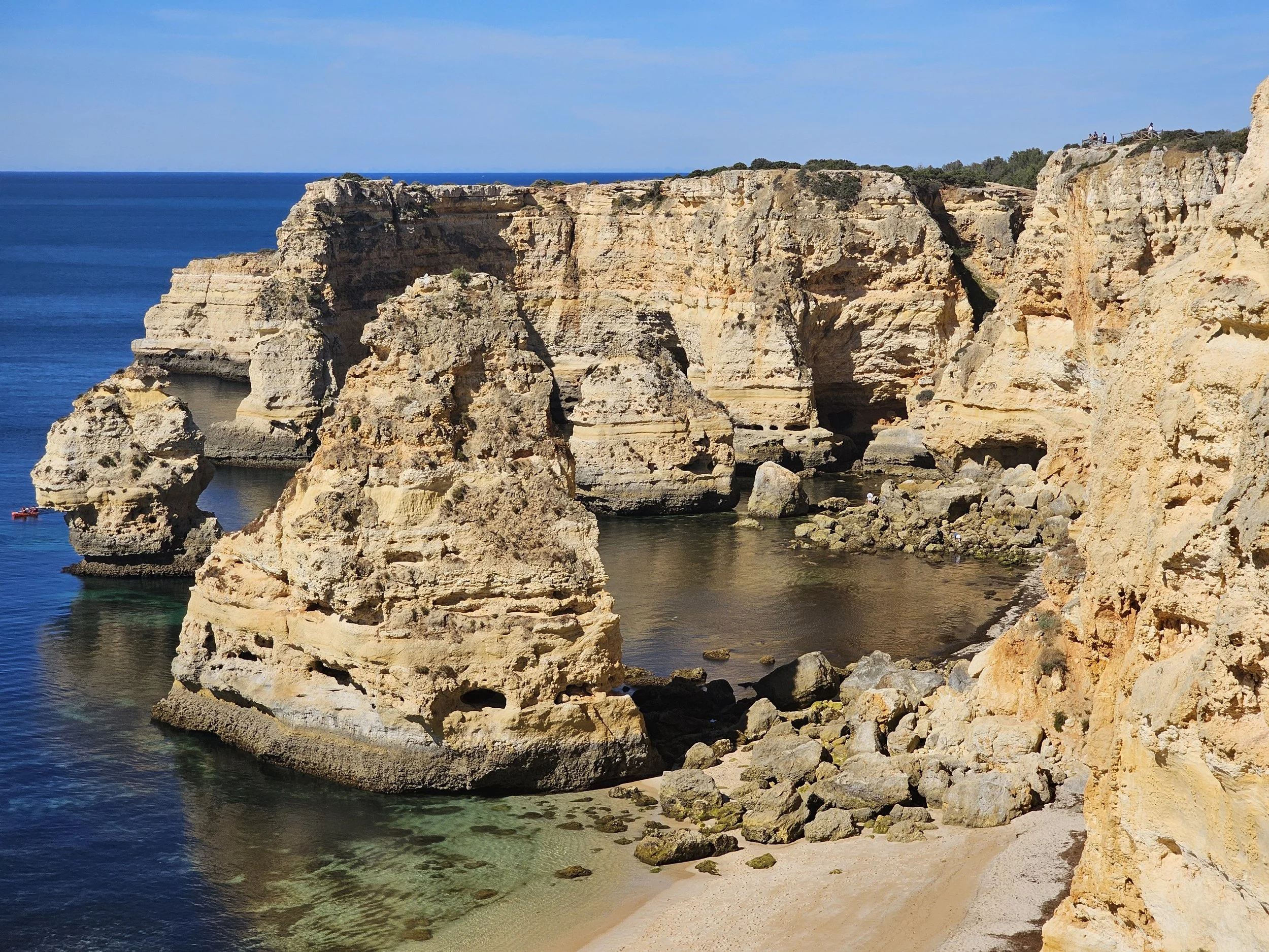 Rock cliffs on an ocean with a text overlay that says Portugal