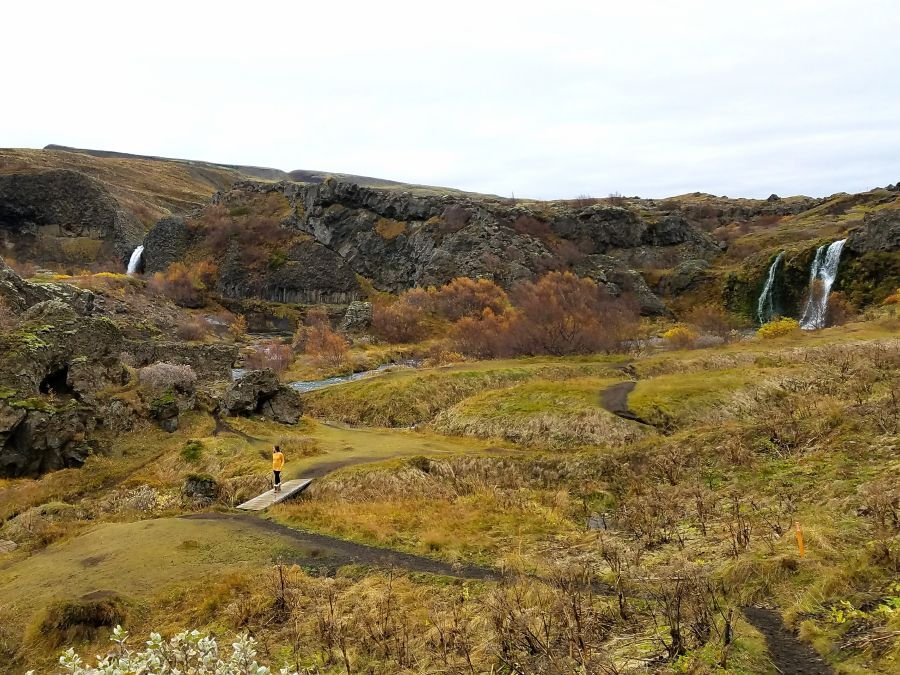 Wide view of a valley in Iceland with waterfalls