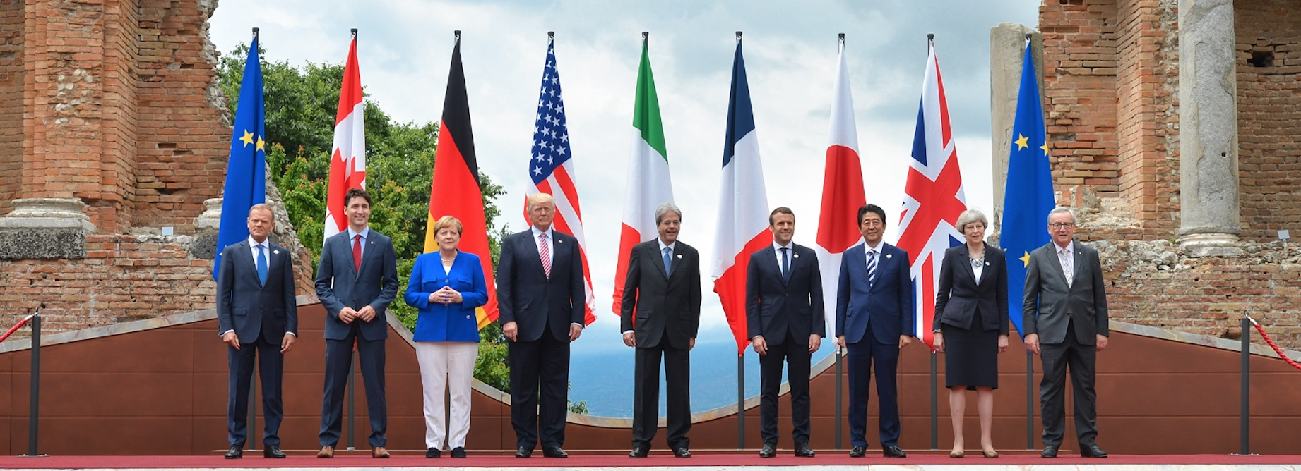 President Trump and Prime Minister May with other world leaders at the 2017 G7 Summit in Sicily ( source )