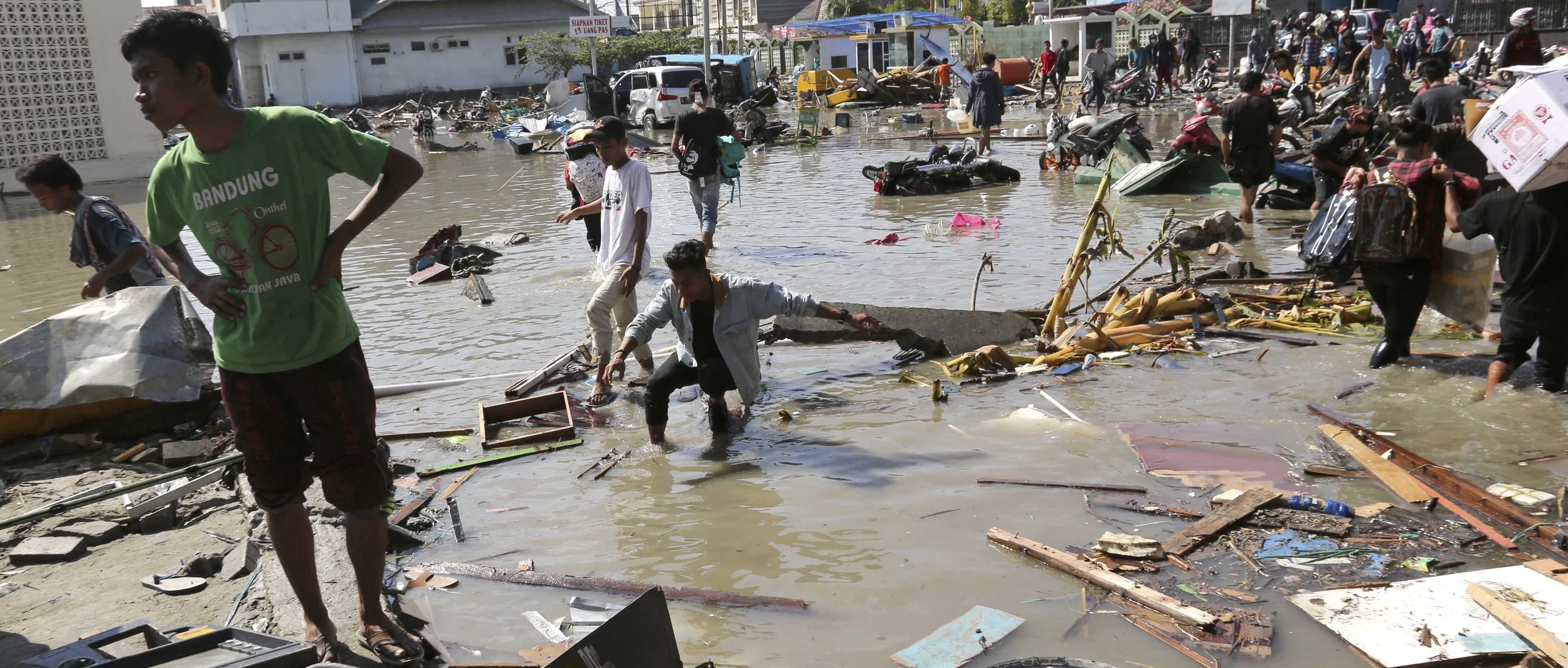 Devastation in Palu following the tsunami that struck the island Friday ( source )