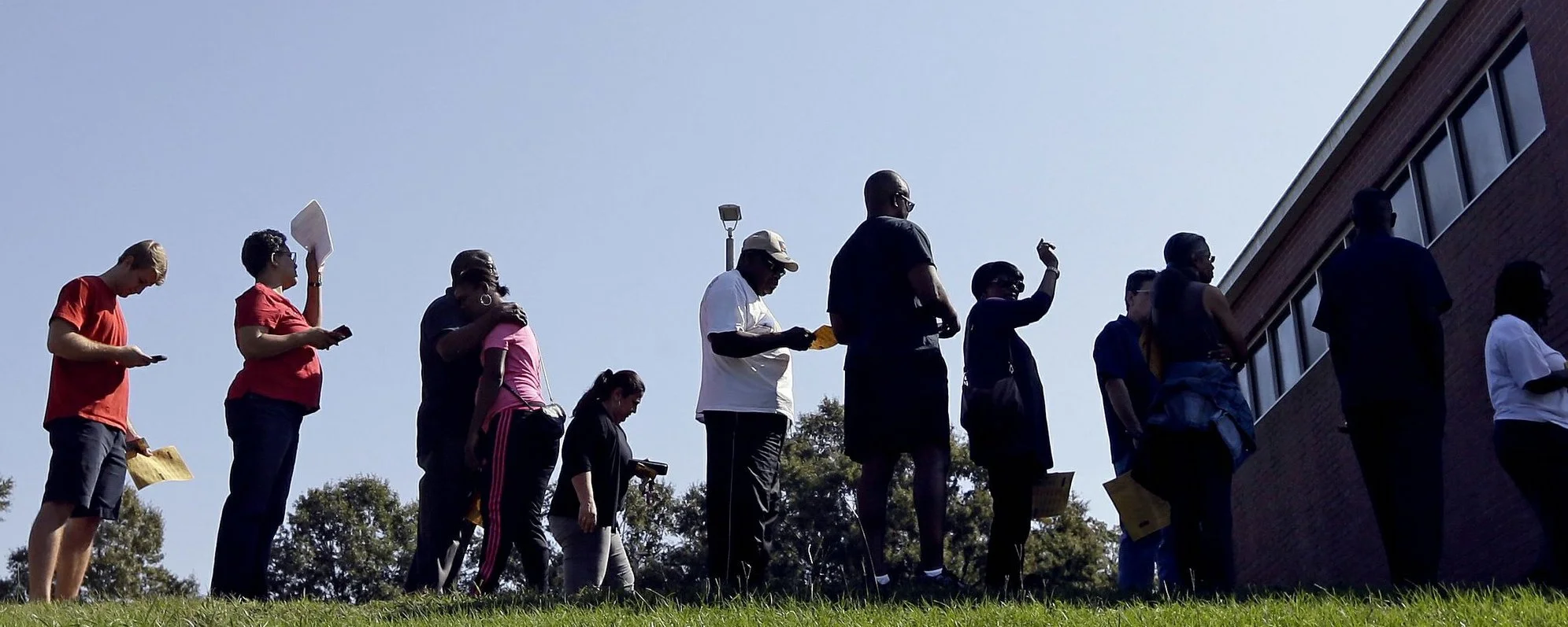 North Carolina voters in line at a Raleigh polling place in 2016 ( Image )