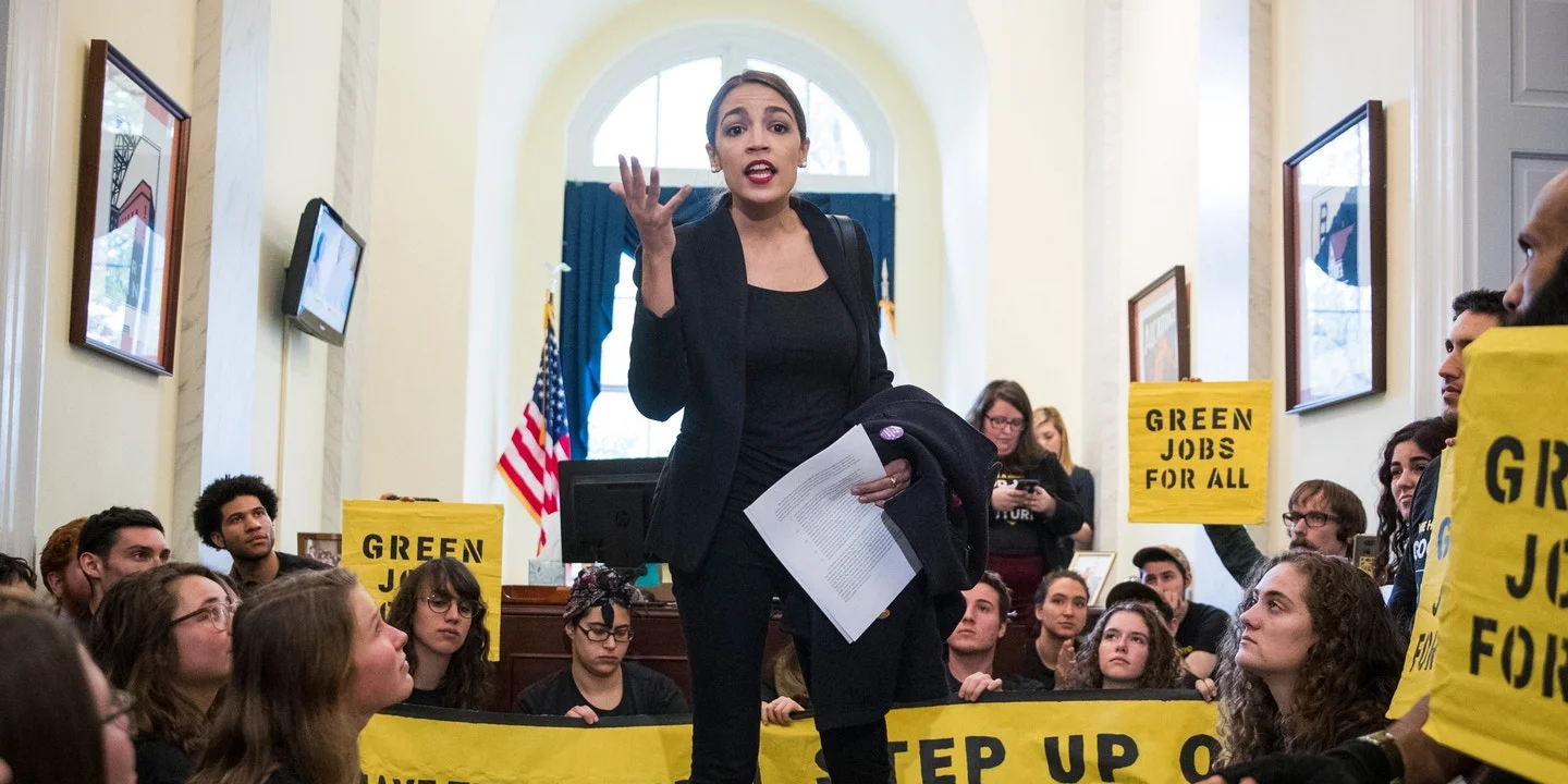 Incoming Representative Alexandria Ocasio-Cortez speaking to a group of activists from the Sunrise Movement in the Capitol ( Image )