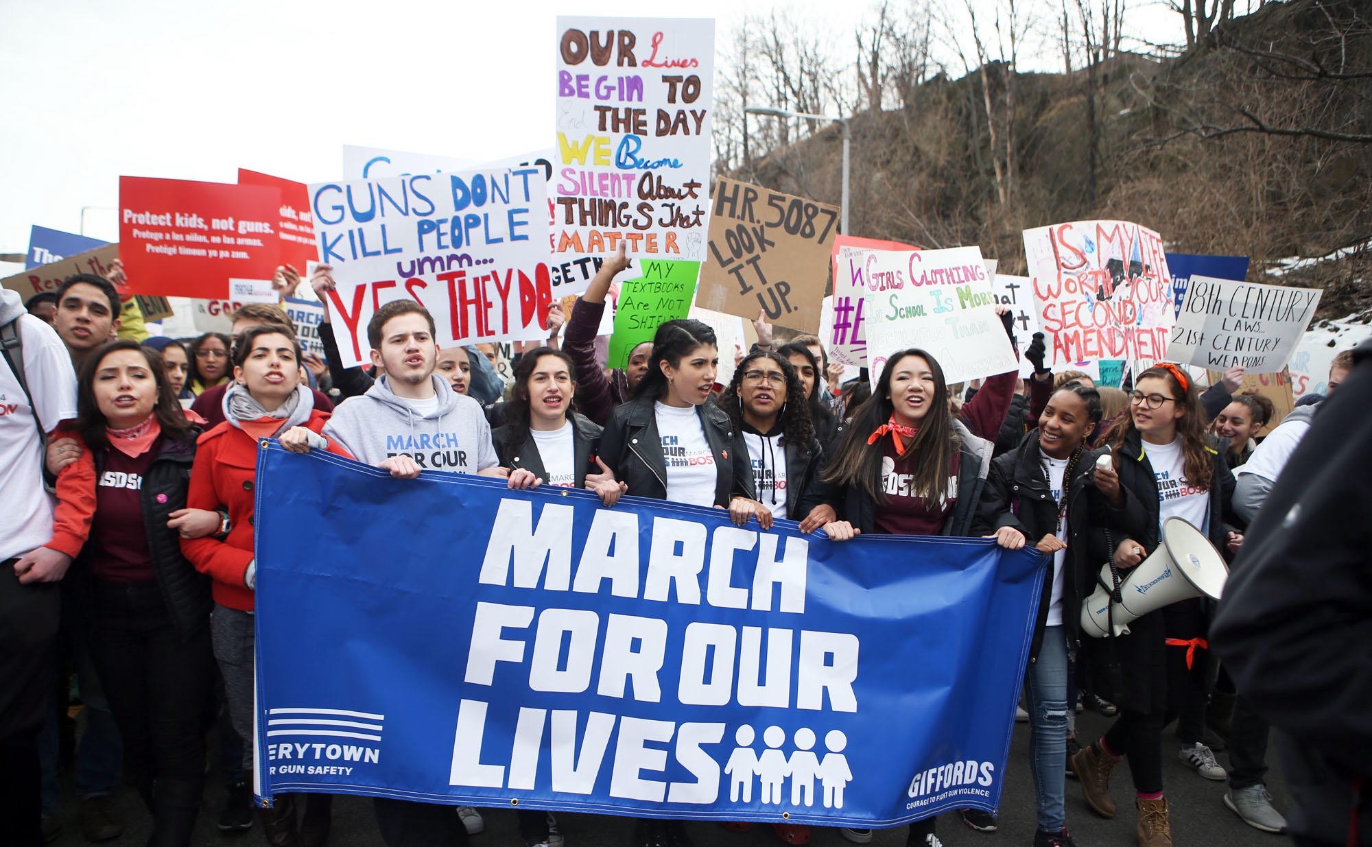 Demonstrators attending a March for Our Lives rally in support of gun control measures ( Image )