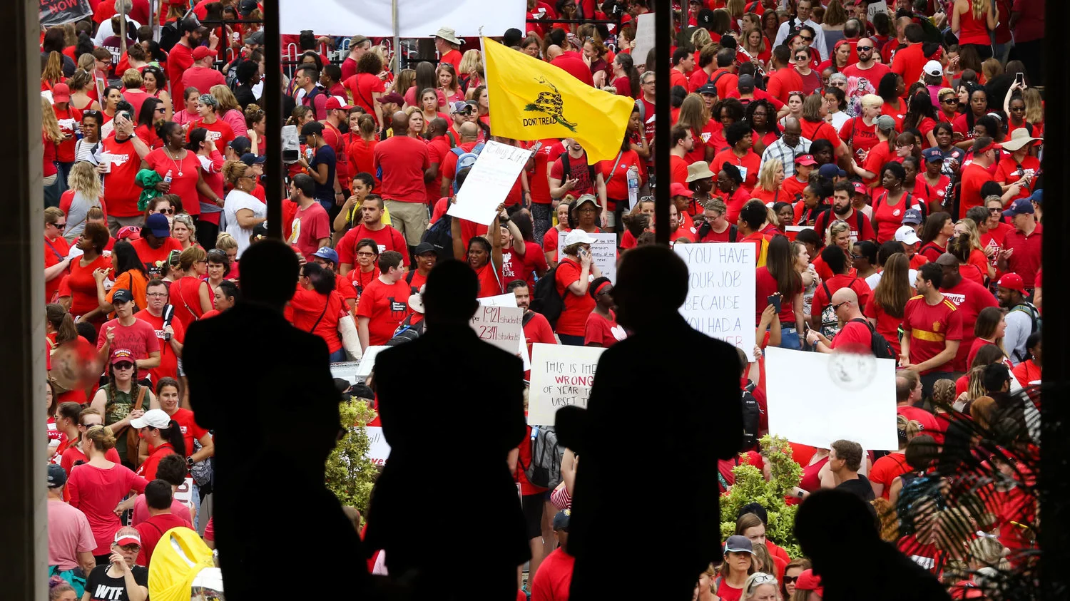 Demonstrators, largely educators and school workers, seen outside the North Carolina State Capitol in May of last year ( Image )