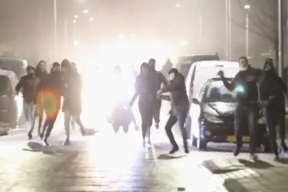 Anti-COVID restriction rioters in Haalem, Netherlands throw rocks at police. Source.