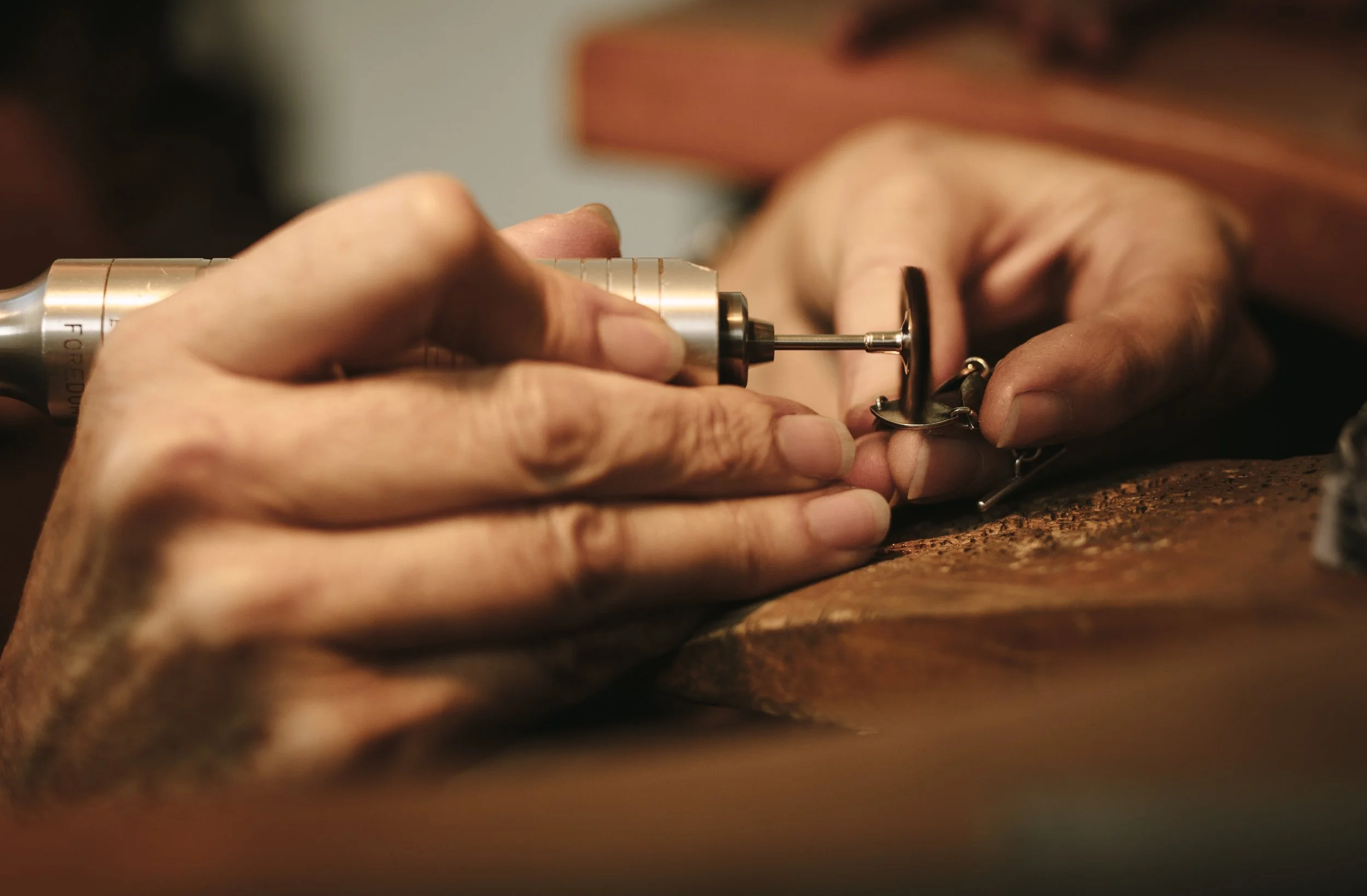 Close up of hands creating a diamond ring.