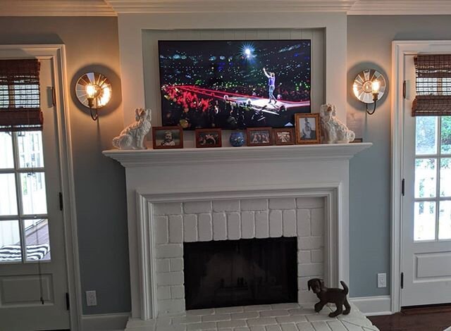 Finished a small bedroom upgrade today. 
The owner wanted the columns to match top and bottom of the mantle so they had the upper section of fireplace redone. This allowed for a larger TV but not a deeper TV. Had to find the slimmest mount possible a