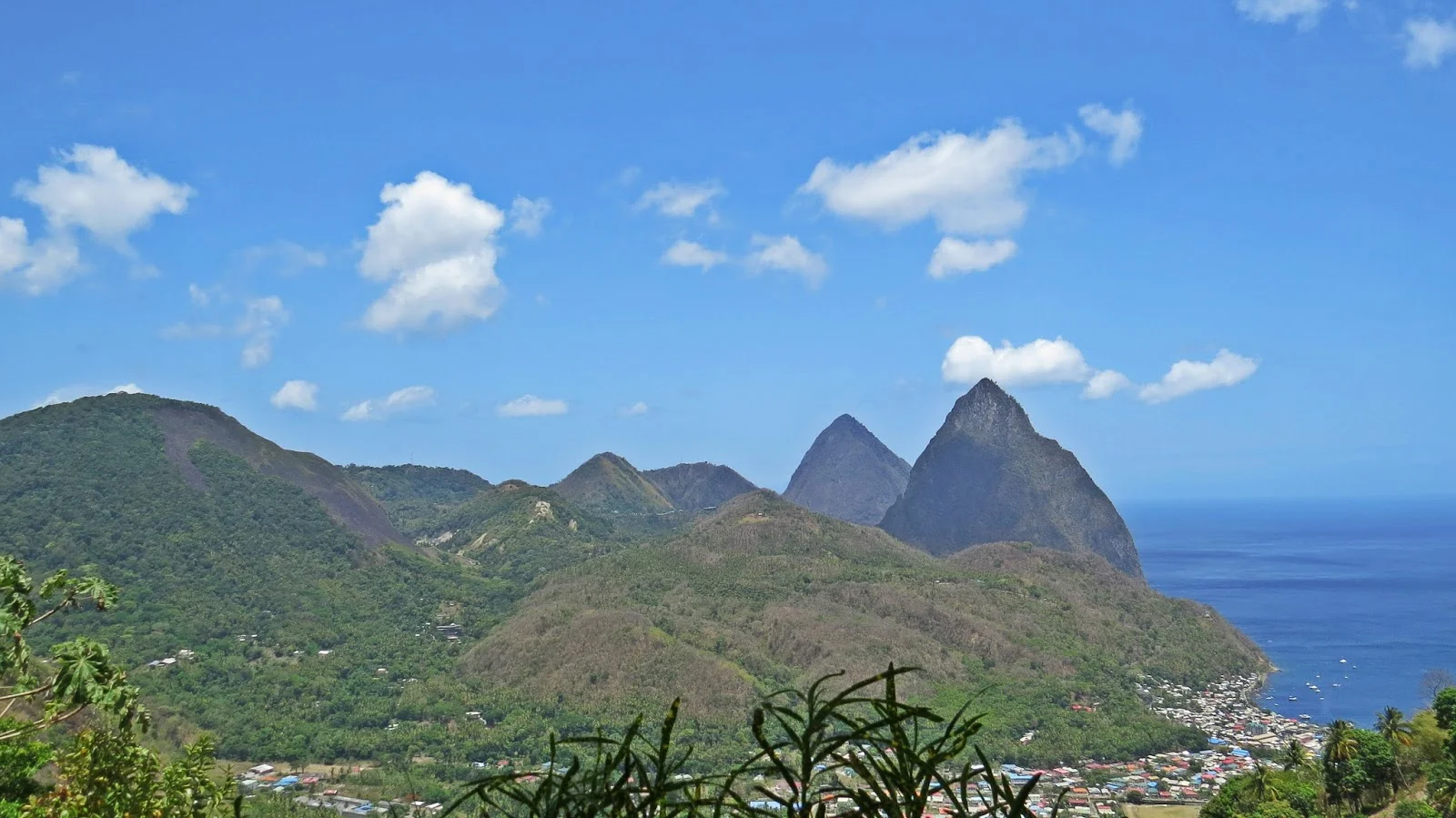 The volcano is in the very left of the picture - the dome with black rocks running down the right side.