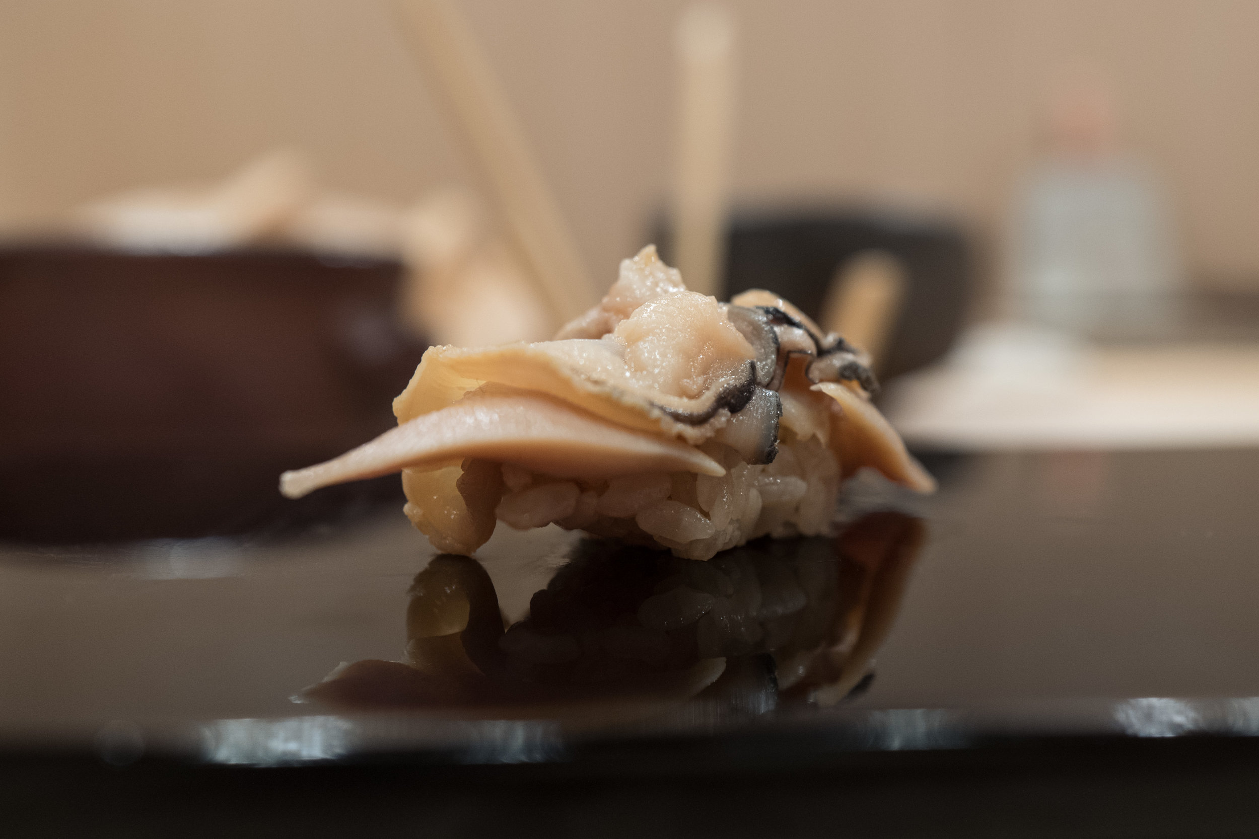  At the end of the meal, chef Keita realized he forgot to serve me a piece of hamaguri. He laughed, apologized, and offered it to me as a final piece. It was delicious, and actually a nice way to end the meal.&nbsp; 