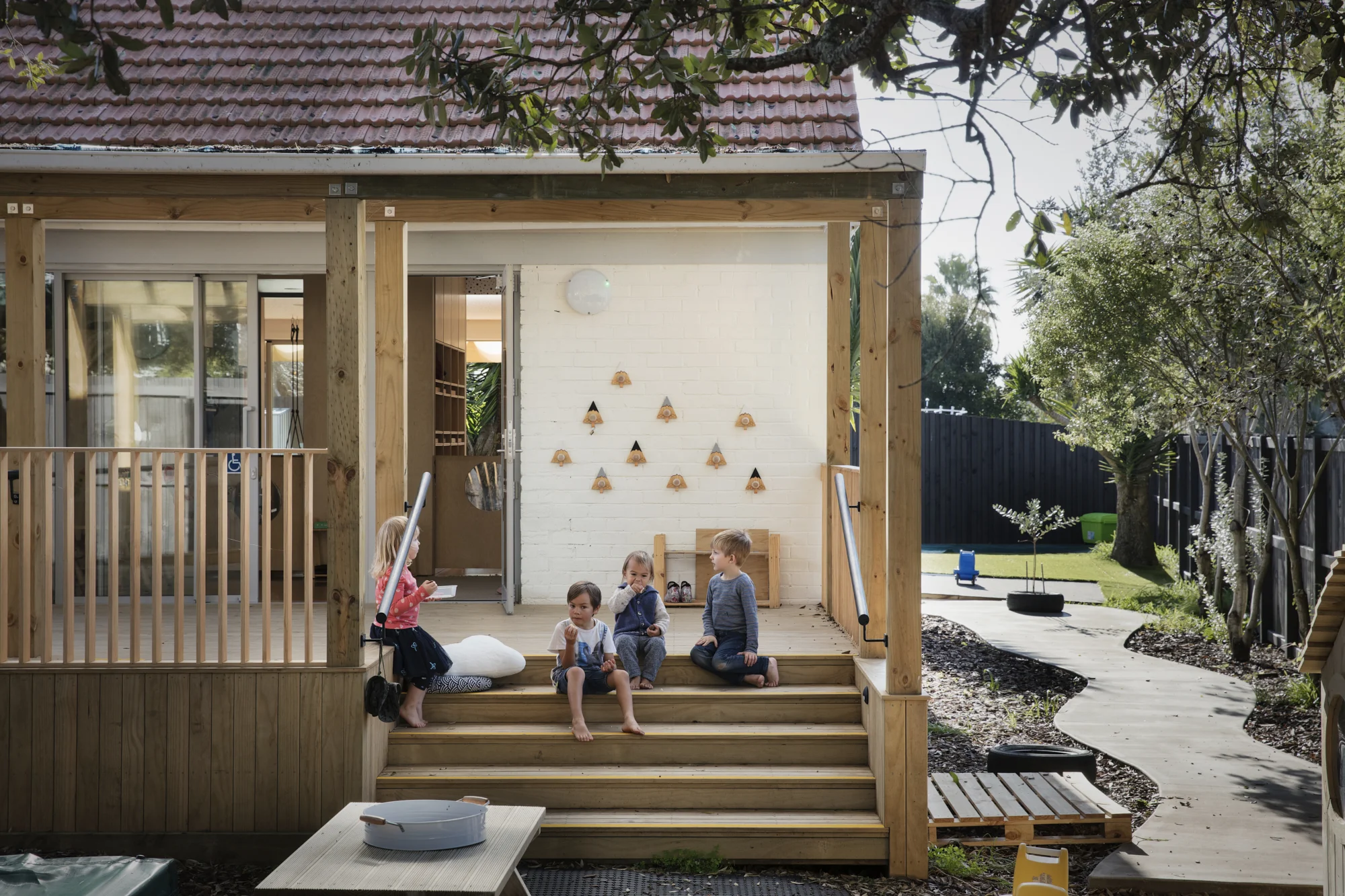 The new covered deck and entry to the existing house