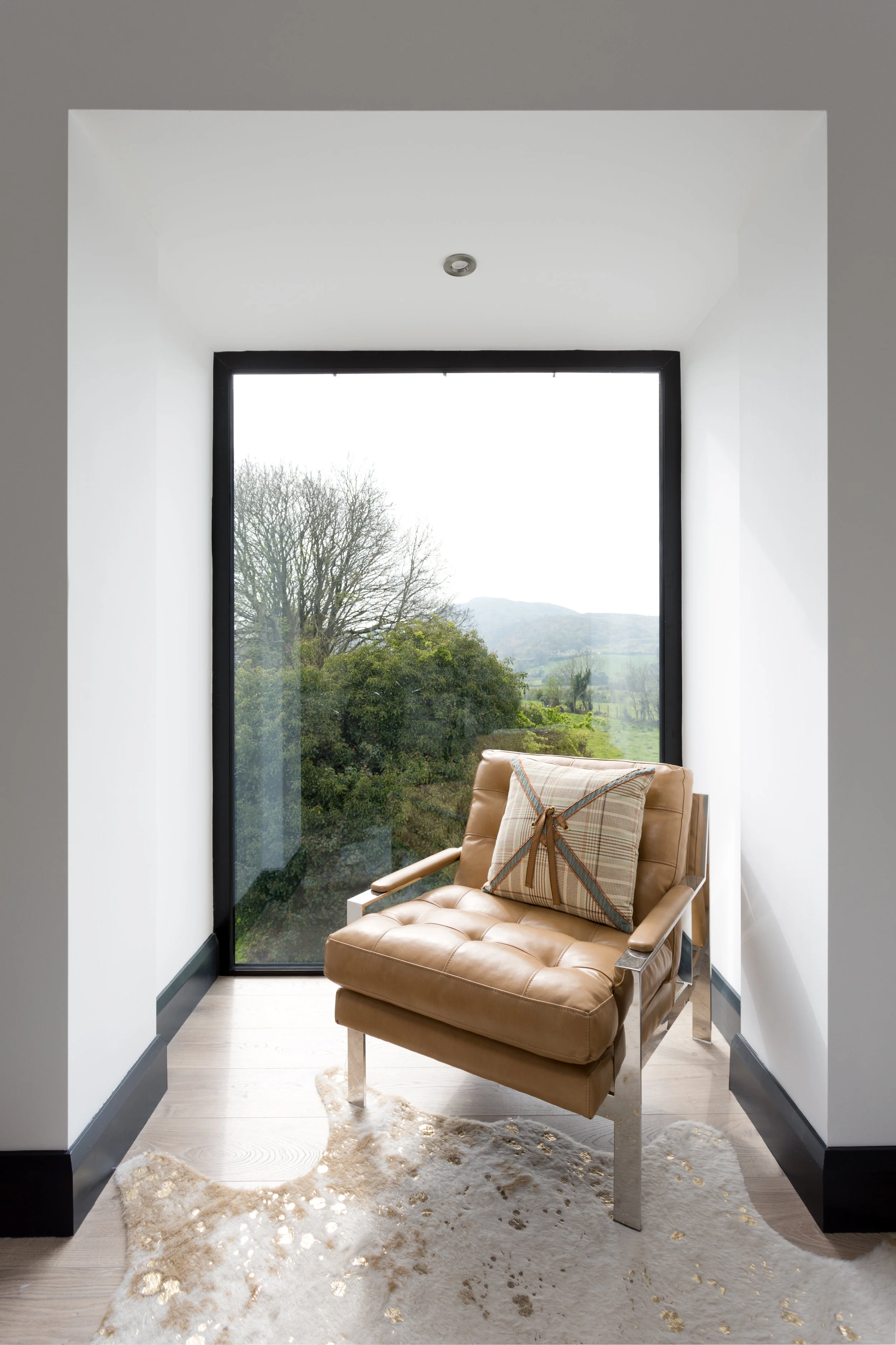 This bedroom window creates a nook to sit and enjoy the view.