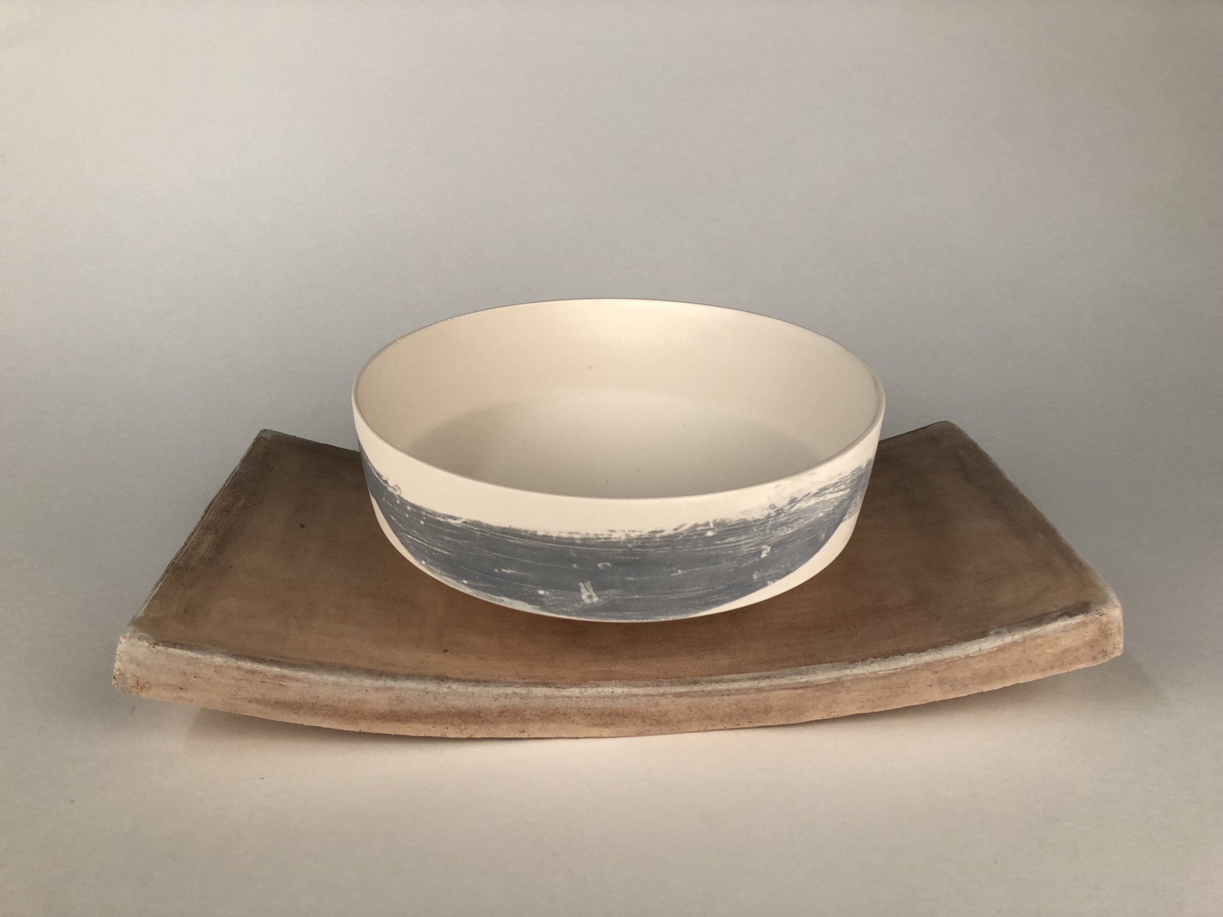The rustic aesthetic of stoneware is contrasted with the fragile aesthetic of porcelain.