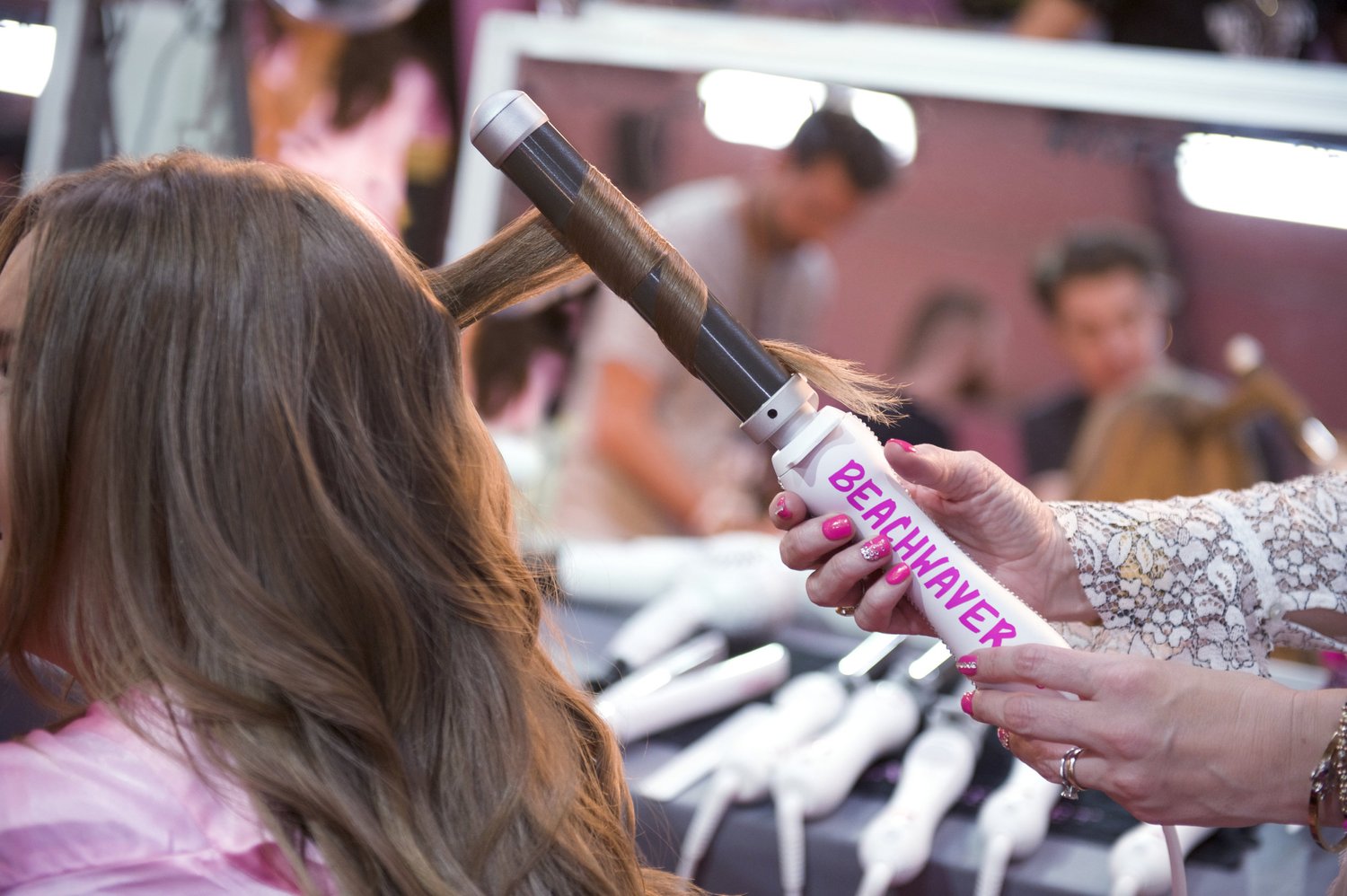 Curling hair with the Beachwaver rotating curling iron