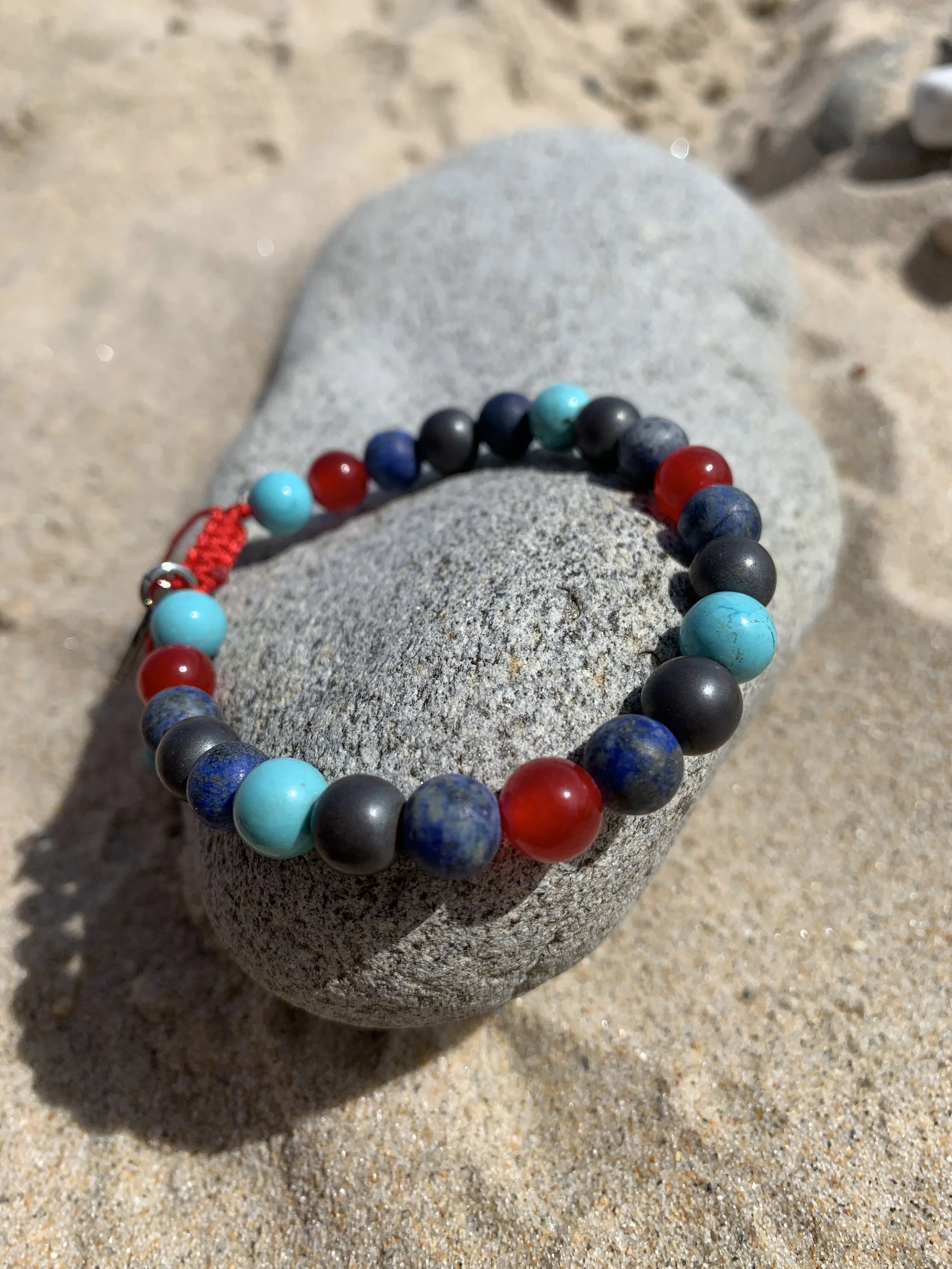 kindness on rock at beach.JPG