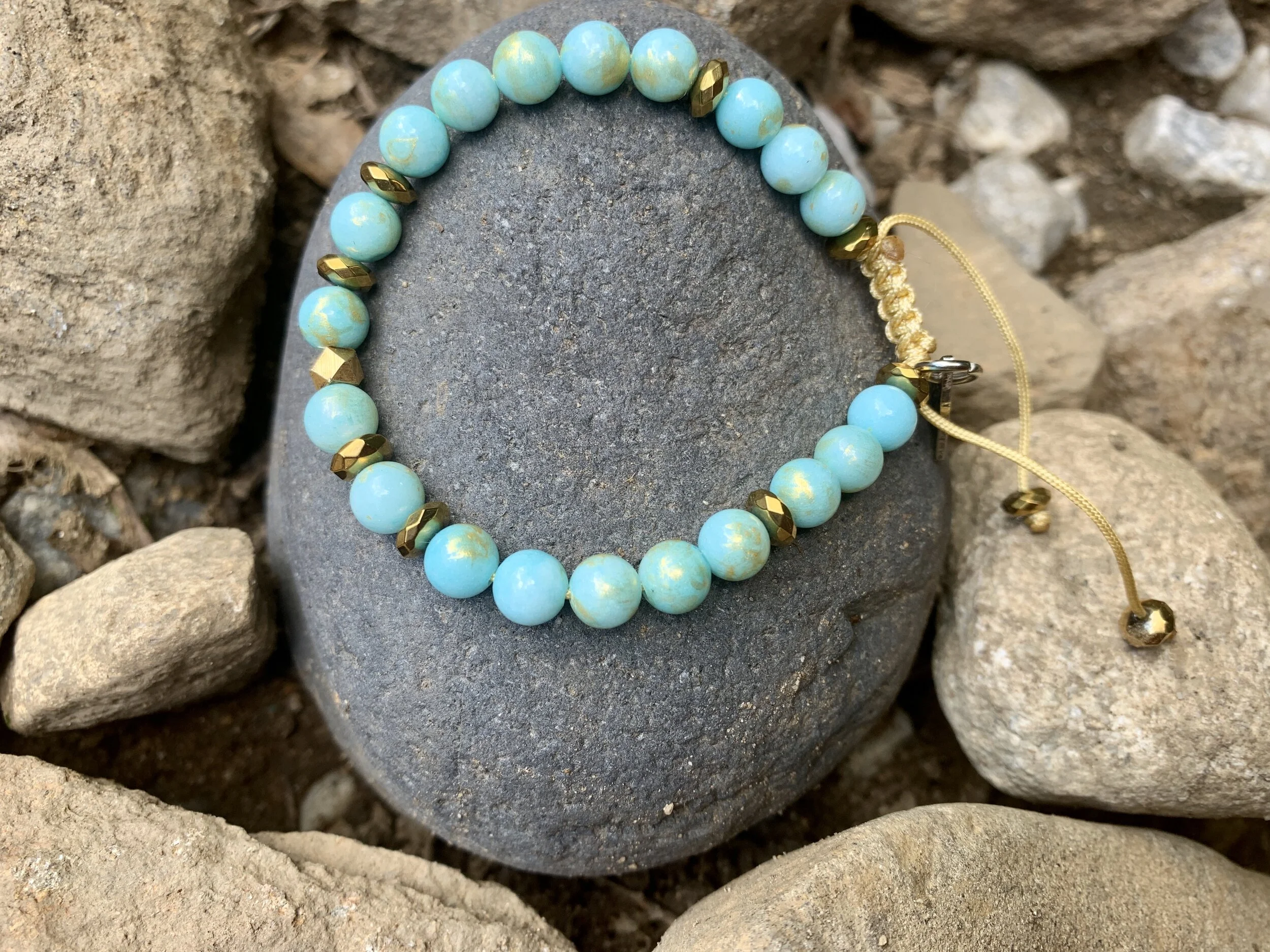 aqua gold jade on rock.jpg