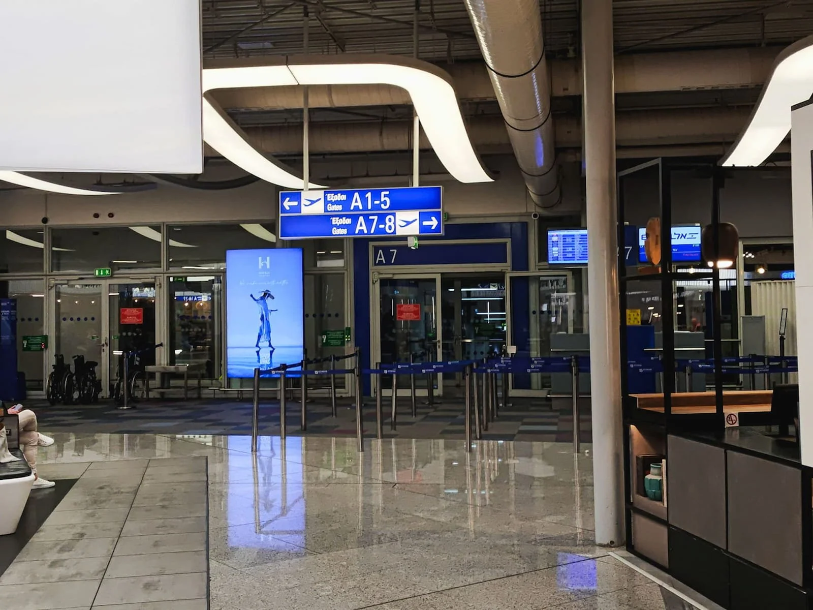 Departure gates at Athens International Airport leading to shuttle buses