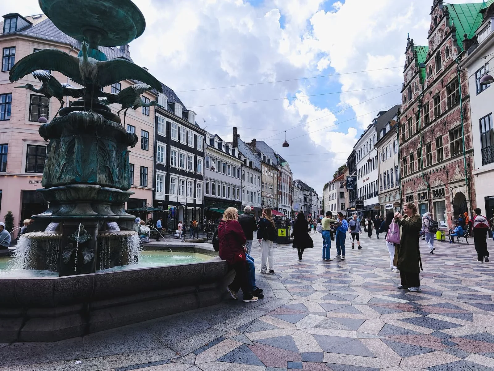 Stork Fountain and surrounding historic buildings at Amagertorv along Strøget in central Copenhagen.
