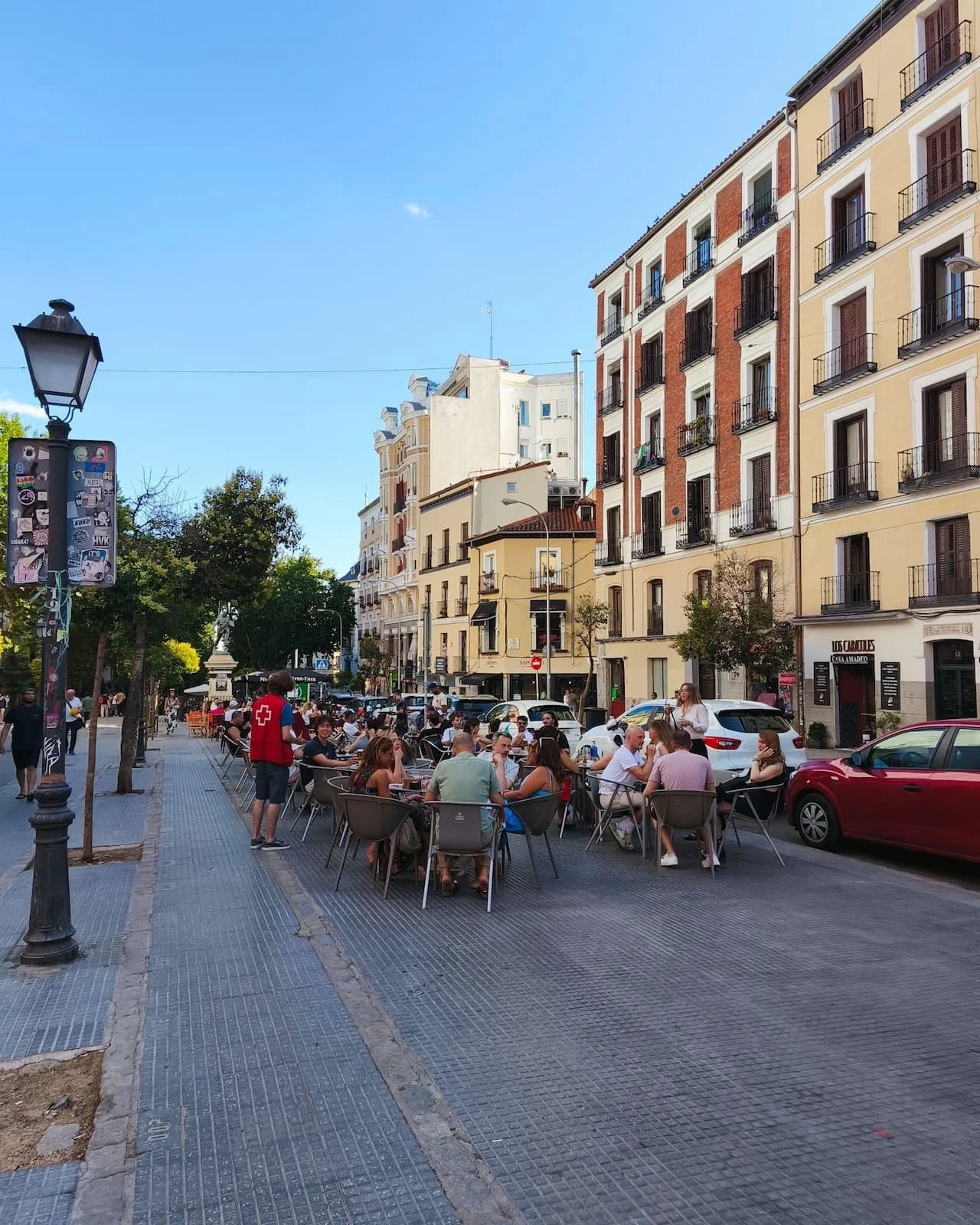 Outdoor terraces on a street in La Latina, one of Madrid’s classic tapas neighborhoods.