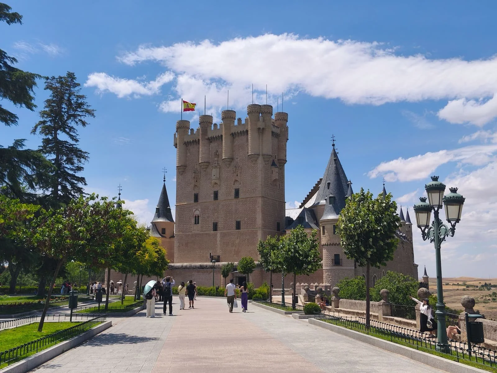 Exterior of the Alcázar of Segovia from the main approach path.