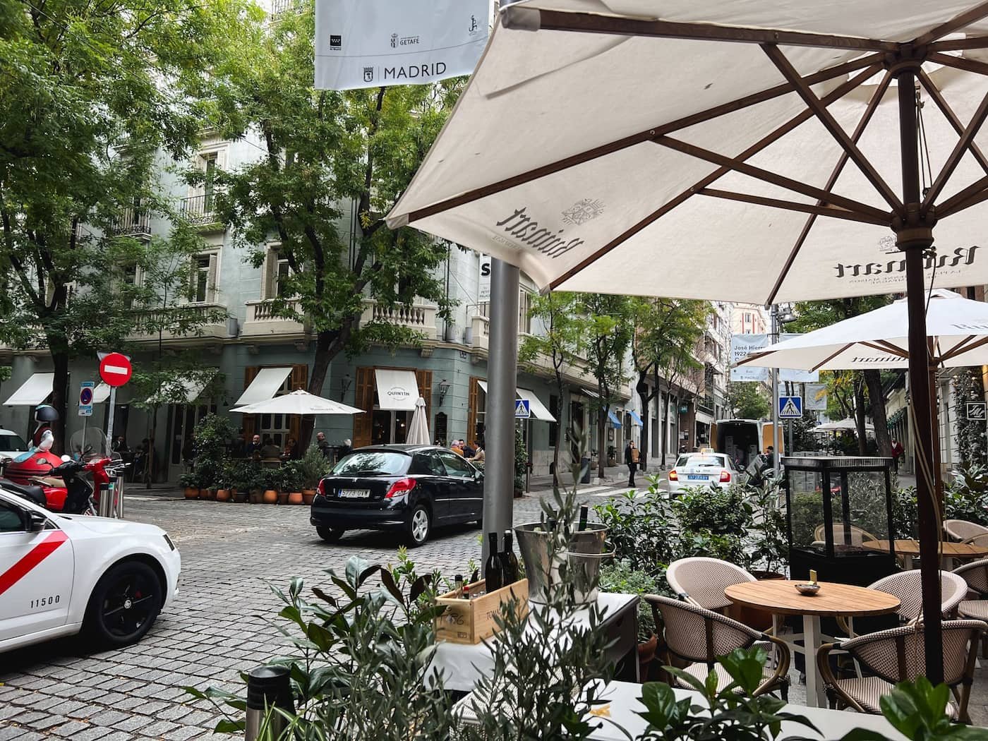 Leafy restaurant terrace on a quiet street in Madrid’s Salamanca neighborhood