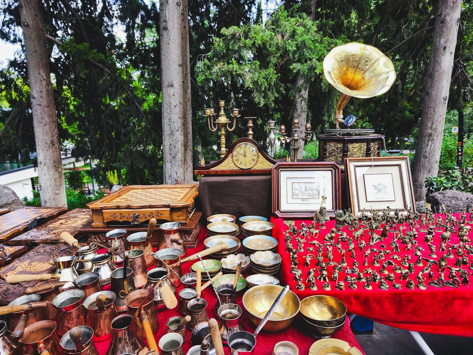 Vintage objects, brassware, and collectibles displayed at Dry Bridge Market in Tbilisi