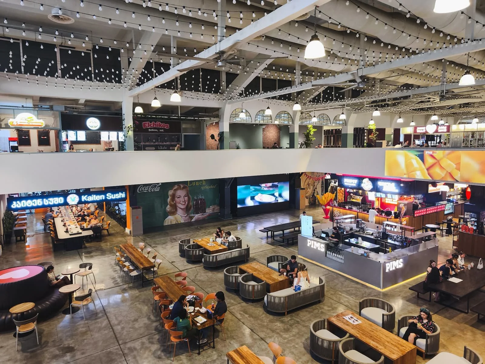 Modern interior and communal seating at Orbeliani Bazaar in Tbilisi