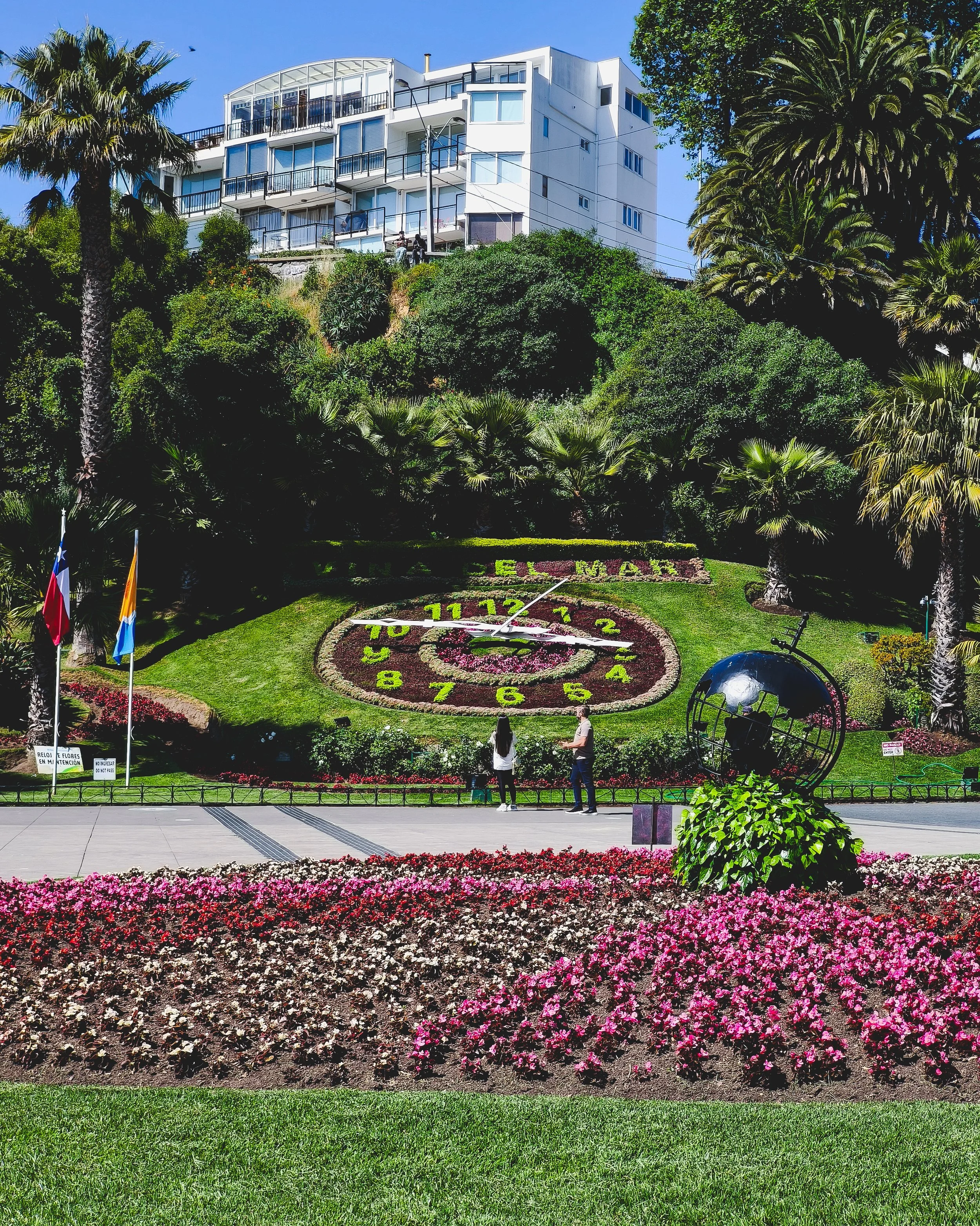 Flower clock and surrounding park.