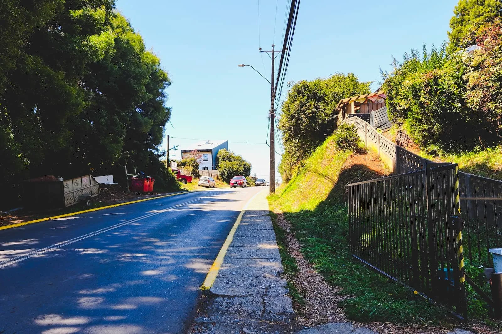 Sidewalk and road in Niebla along the main route travelers use between stops.
