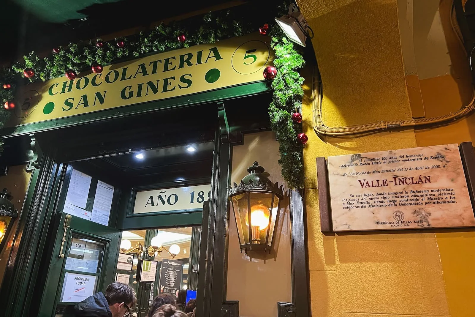 Exterior of Chocolatería San Ginés, a classic churros and chocolate spot near Puerta del Sol in Madrid.
