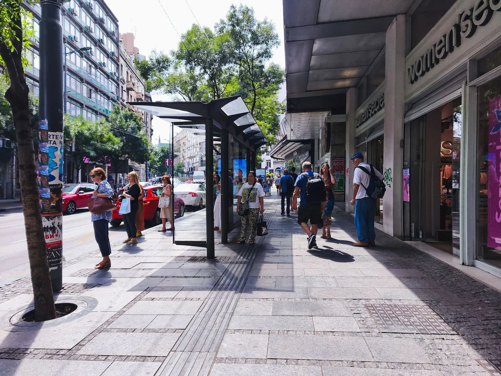 Pedestrians walking along a street in central Belgrade