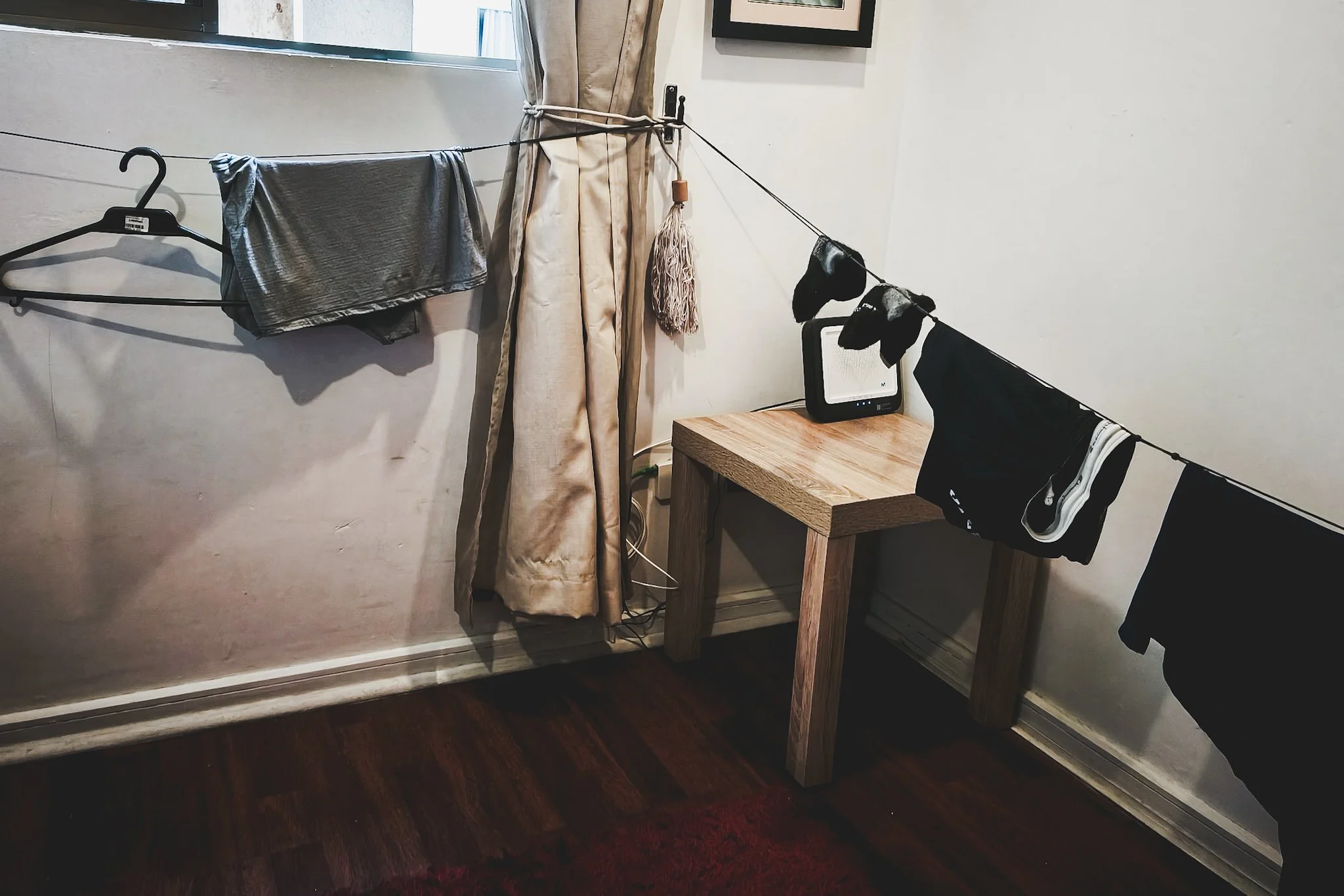 Clothes drying on portable clothesline.