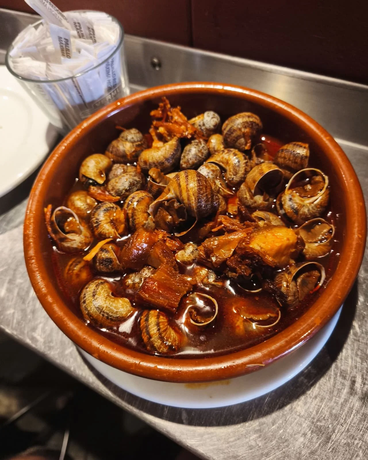 A shared portion of snails at Casa Amadeo Los Caracoles.