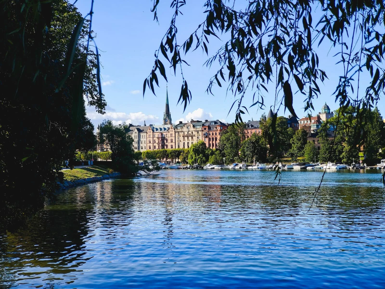 Calm water and historic buildings along Djurgården