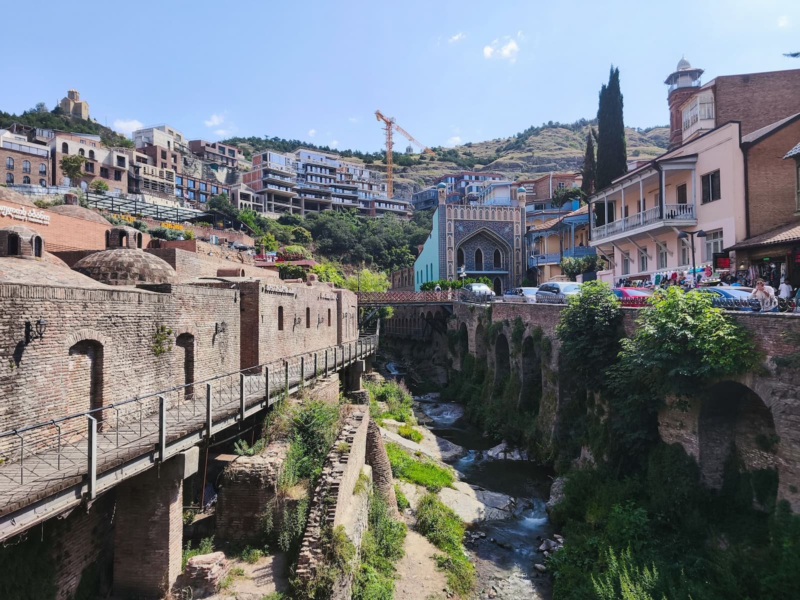 Abanotubani sulfur bath district in Tbilisi with brick bath domes and Chreli Abano in the background