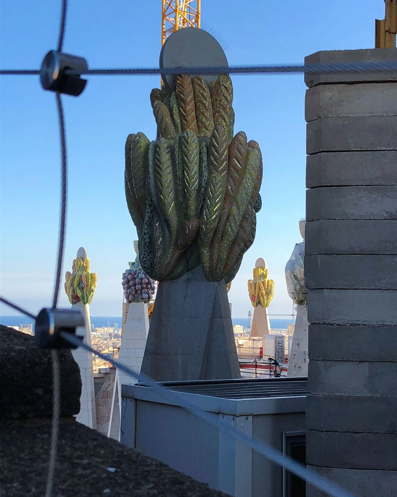 Close-up view of a colorful fruit sculpture from the Sagrada Família tower route