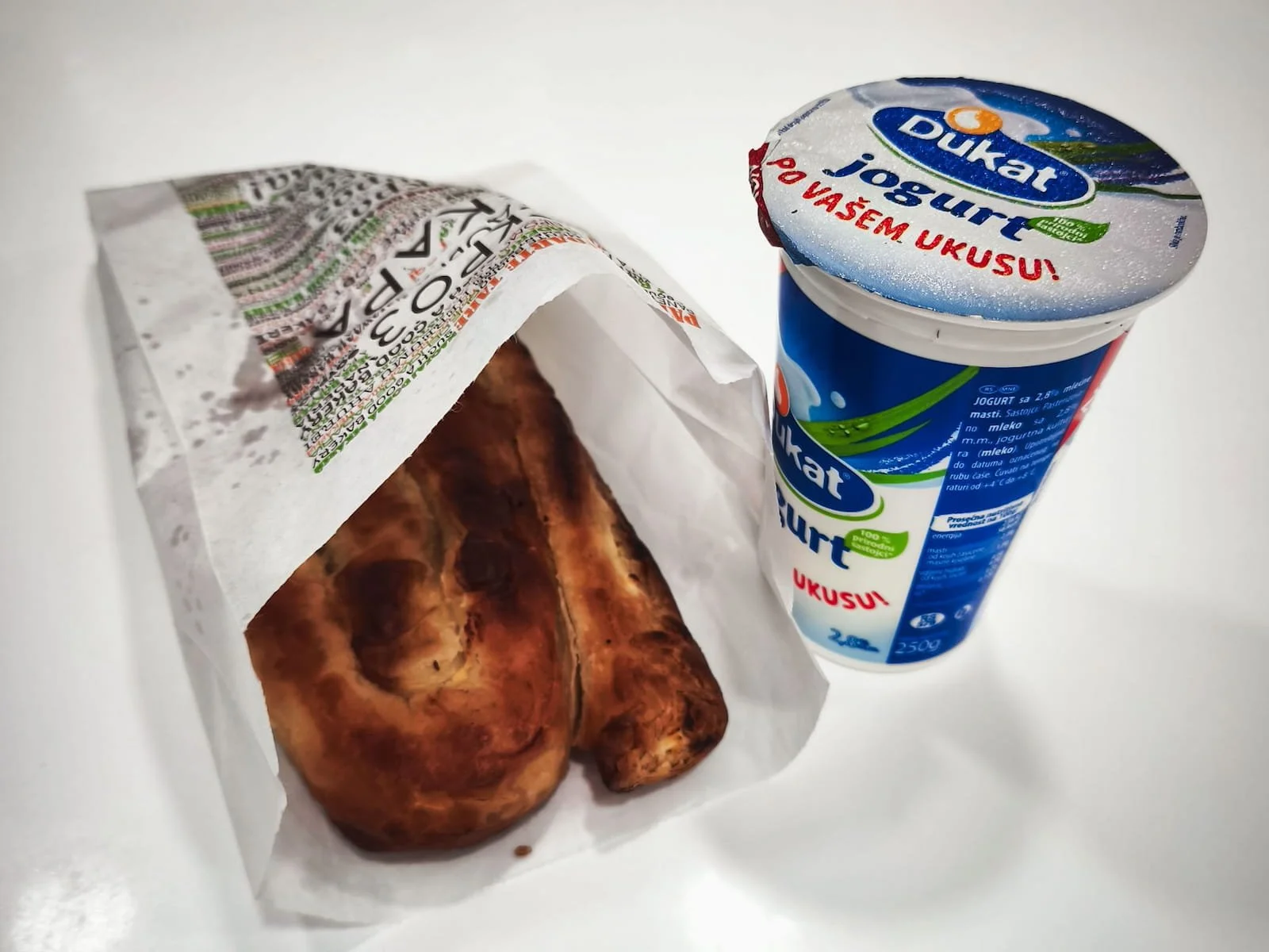 Cheese burek with drinkable yogurt for breakfast in Belgrade