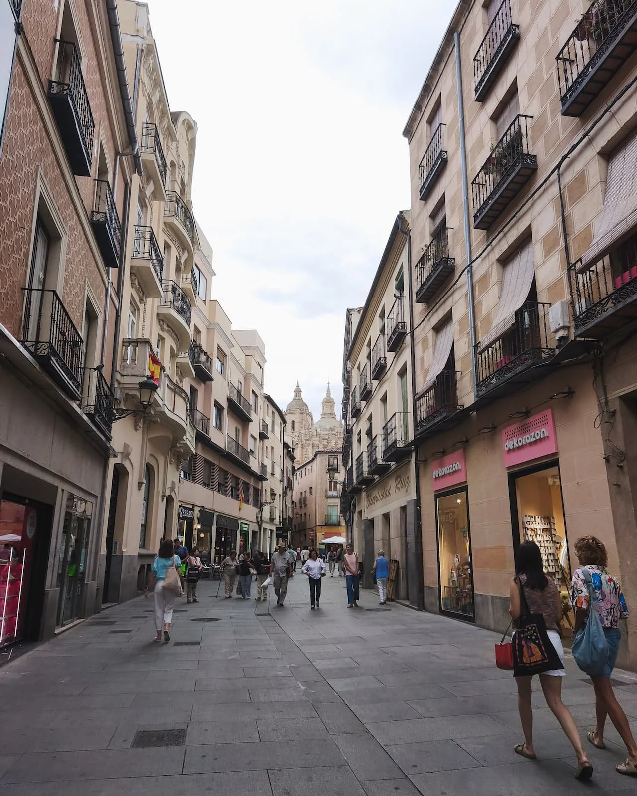 Pedestrian street in Segovia’s old town leading toward the Cathedral.