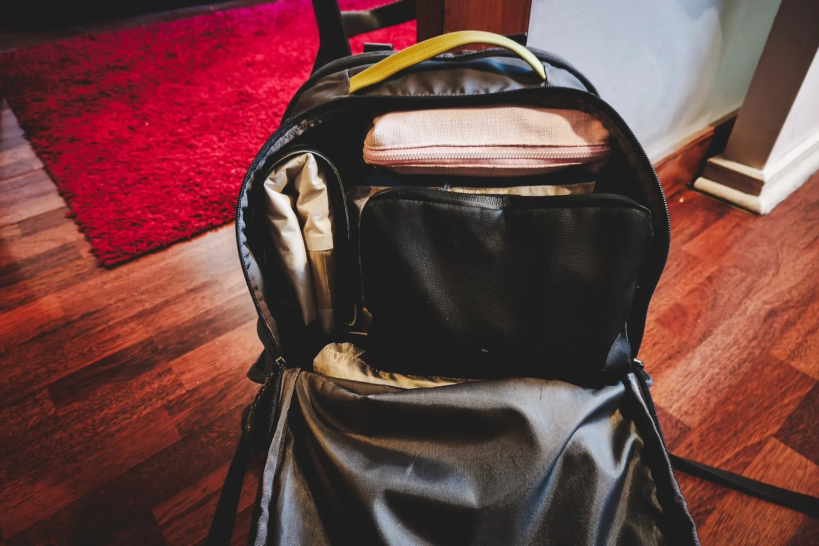 One-bag travel setup with 30L backpack and essentials packed for low-friction travel