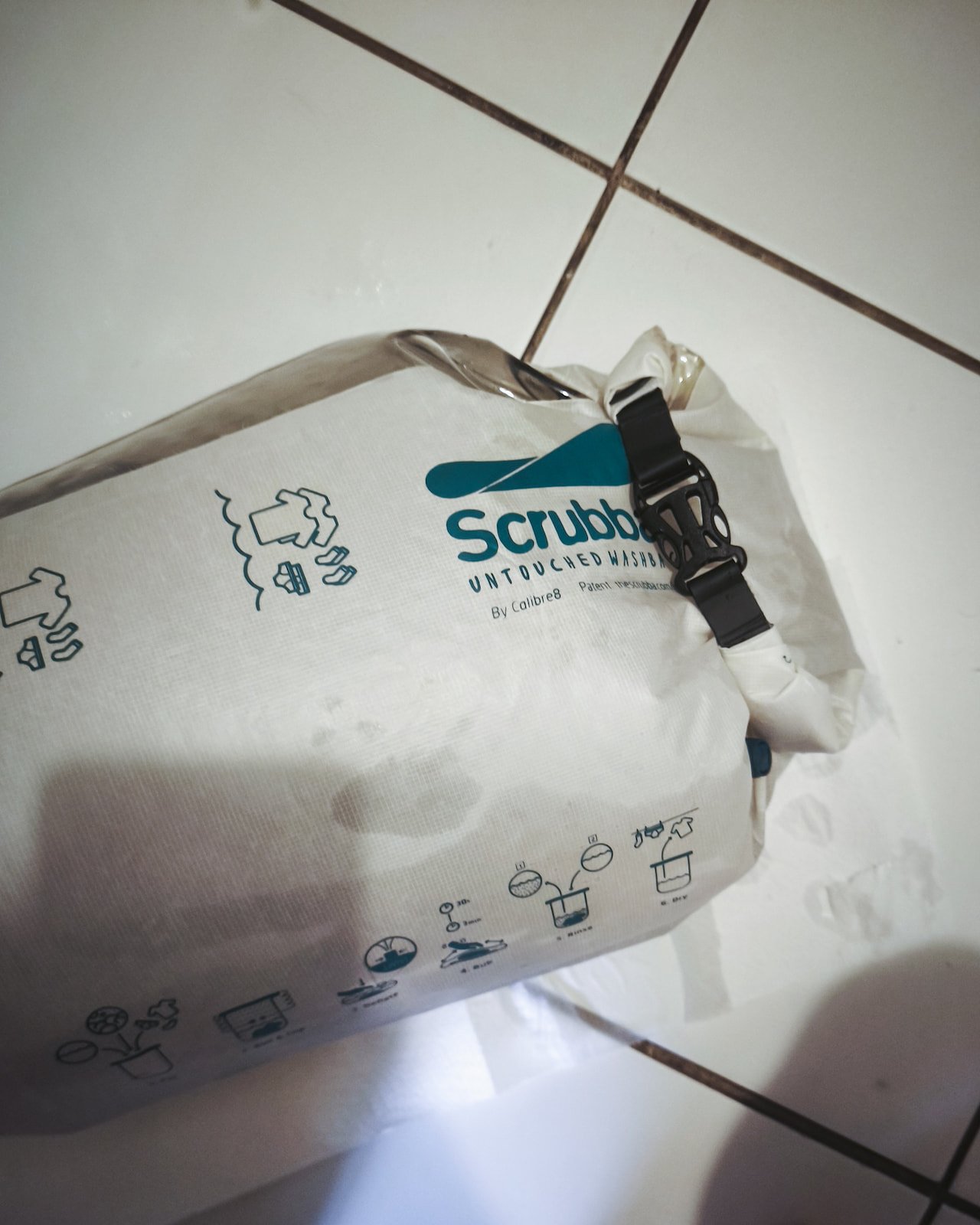 Scrubba wash bag used for washing clothes in the bathroom during travel.