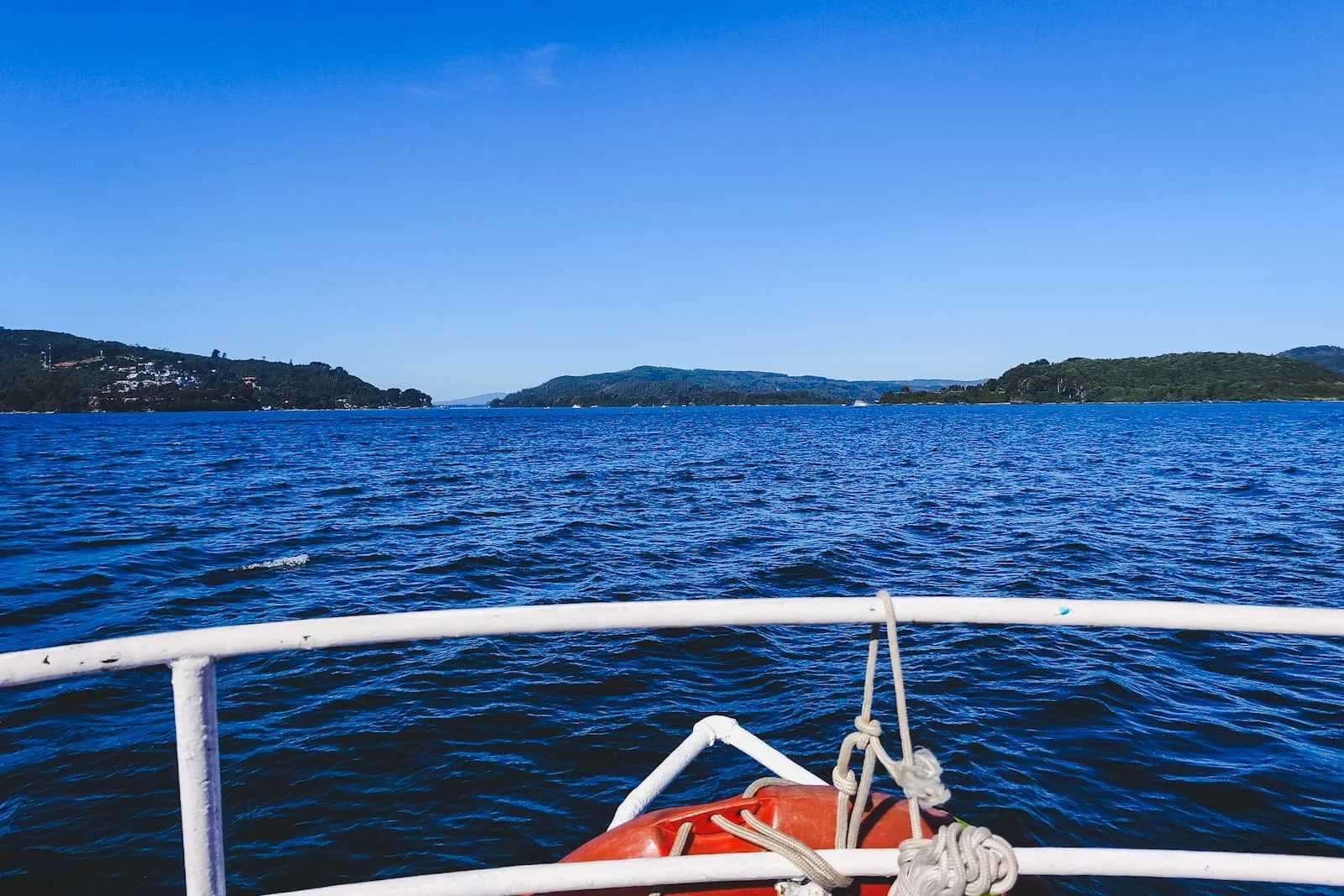 Passenger ferry crossing between Niebla and Corral with wide views across the bay.