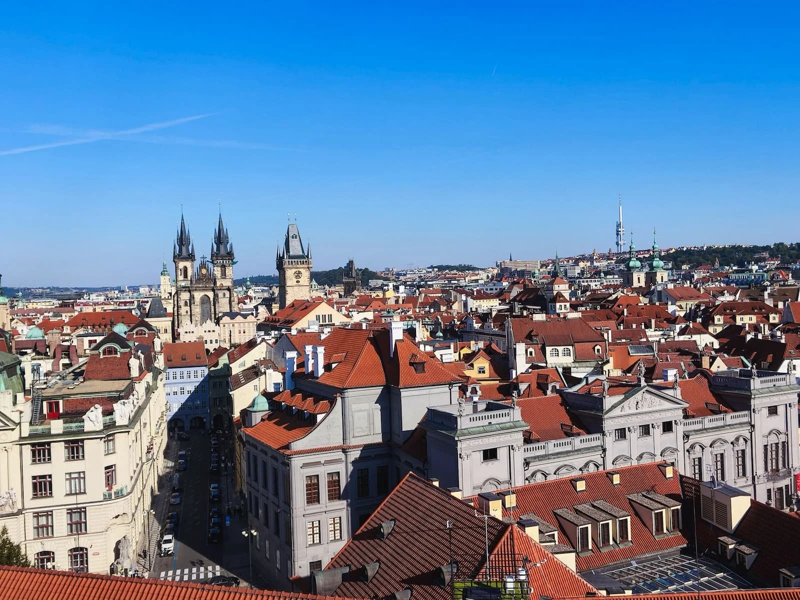 Panoramic view from the Clementinum Astronomical Tower over Prague's red rooftops and the Church of Our Lady before Týn.
