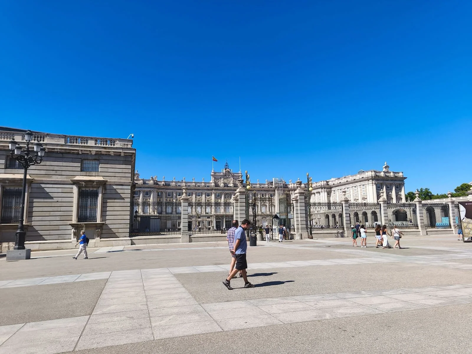Royal Palace of Madrid seen across the open plaza on a sunny day