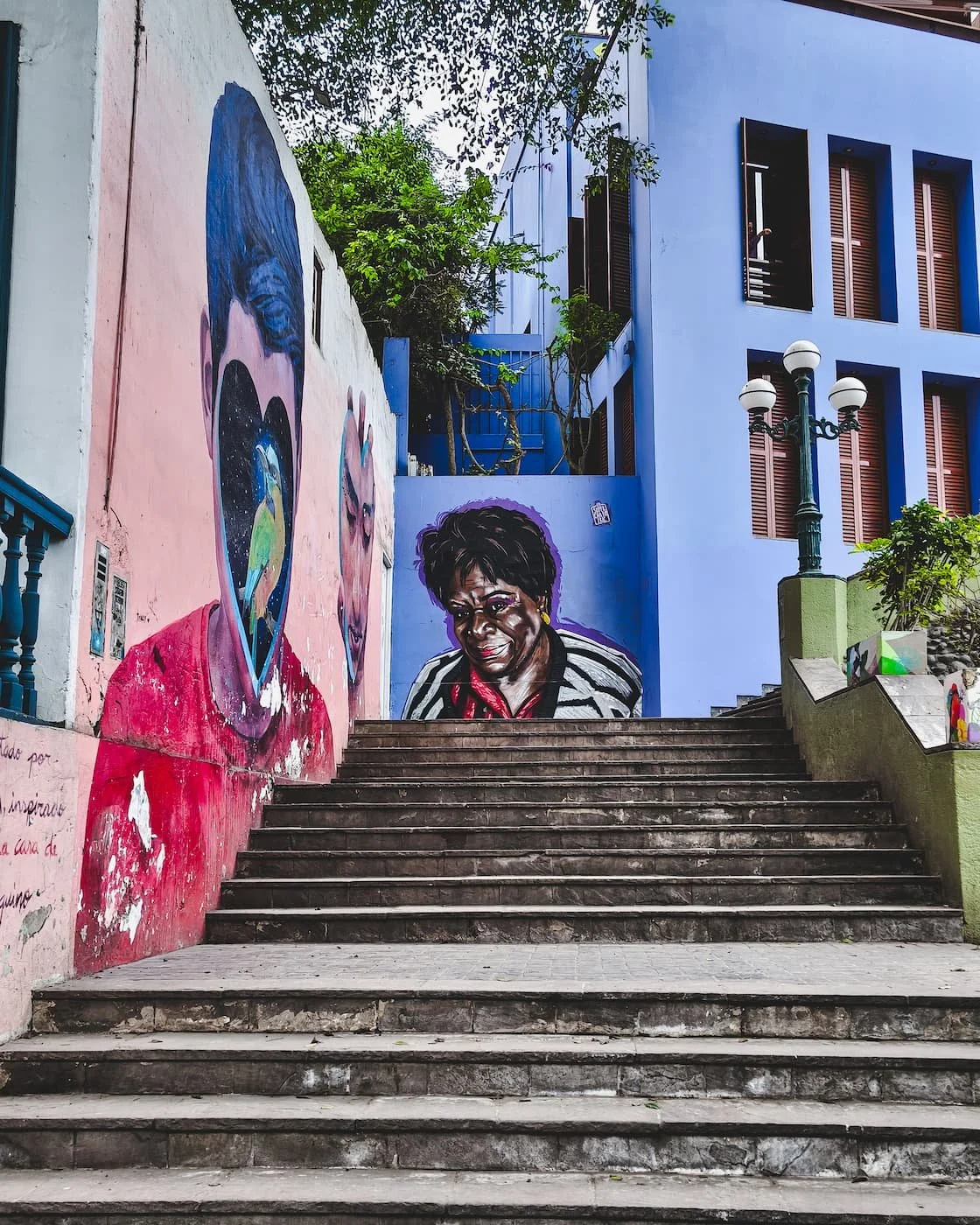 Murals up below Puente de los Suspiros. The left mural is called Hogar de un Suspiro, by Peruvian artist Jade Rivera.