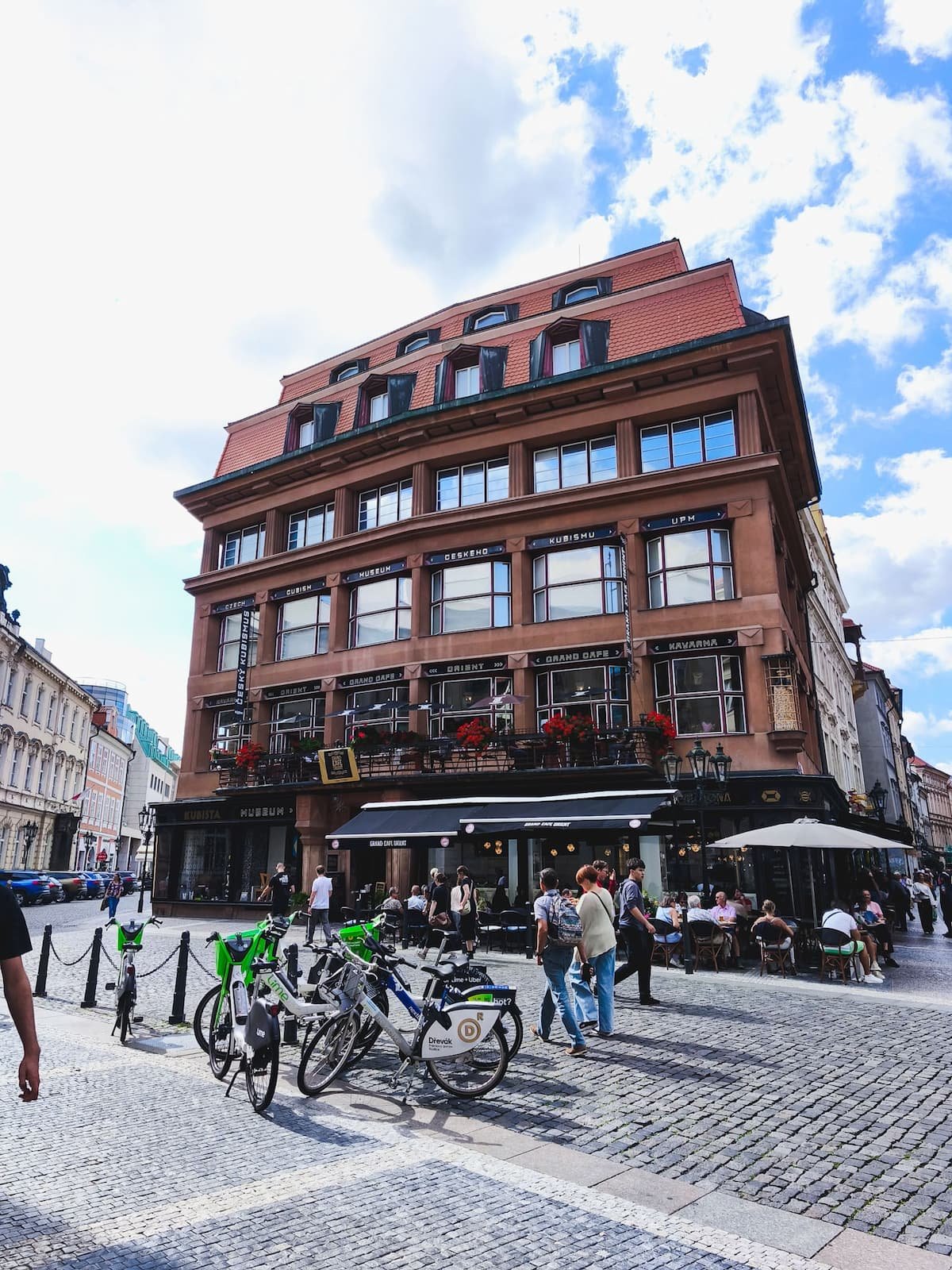 House of the Black Madonna in Prague, with angular architectural details and bicycles parked along the street.