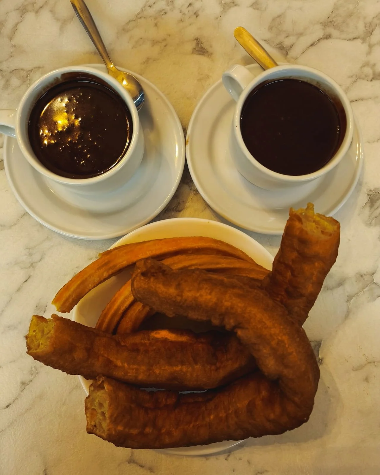 Churros with thick hot chocolate at Chocolatería San Ginés in Madrid.