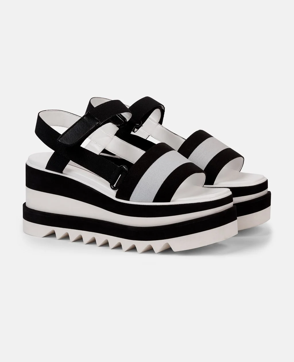 We were already obsessed with the Sneak Elyse by Stella, it is no surprise that we are also obsessing over the Striped Platform Slides. These Minimalist slides featuring contrasting striped band and signature raw-edged platform sole. Pair with a dress, jeans, or just about thing to complete your easy summer ensemble. 