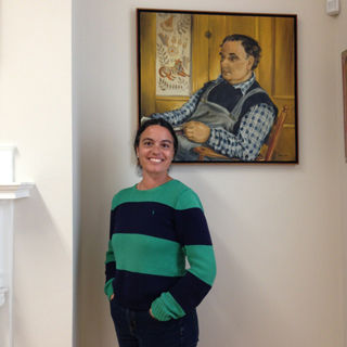 Rachel Walls stands before artist Dahlov Ipcar's portrait of her father, the renowned artist William Zorach. Photo by Pat Davidson Reef.